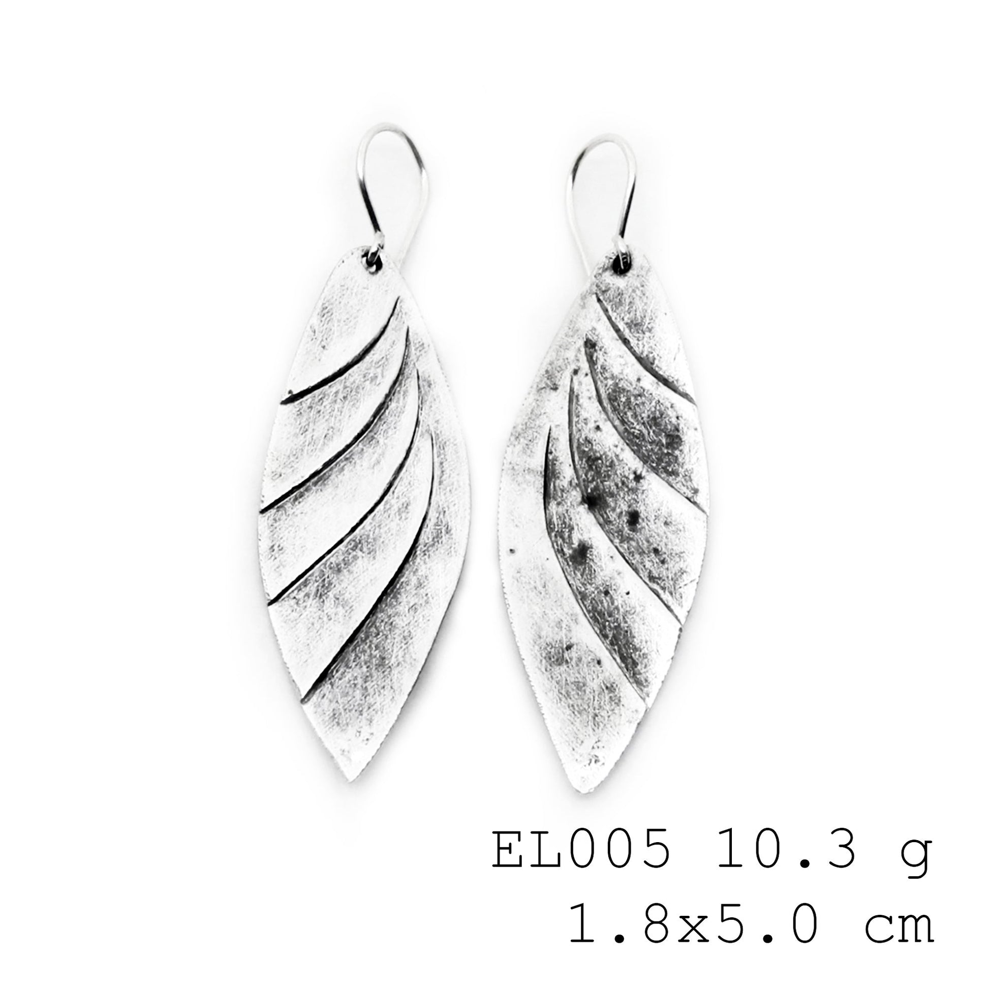 Hand-forged leaf details for these silver earrings.