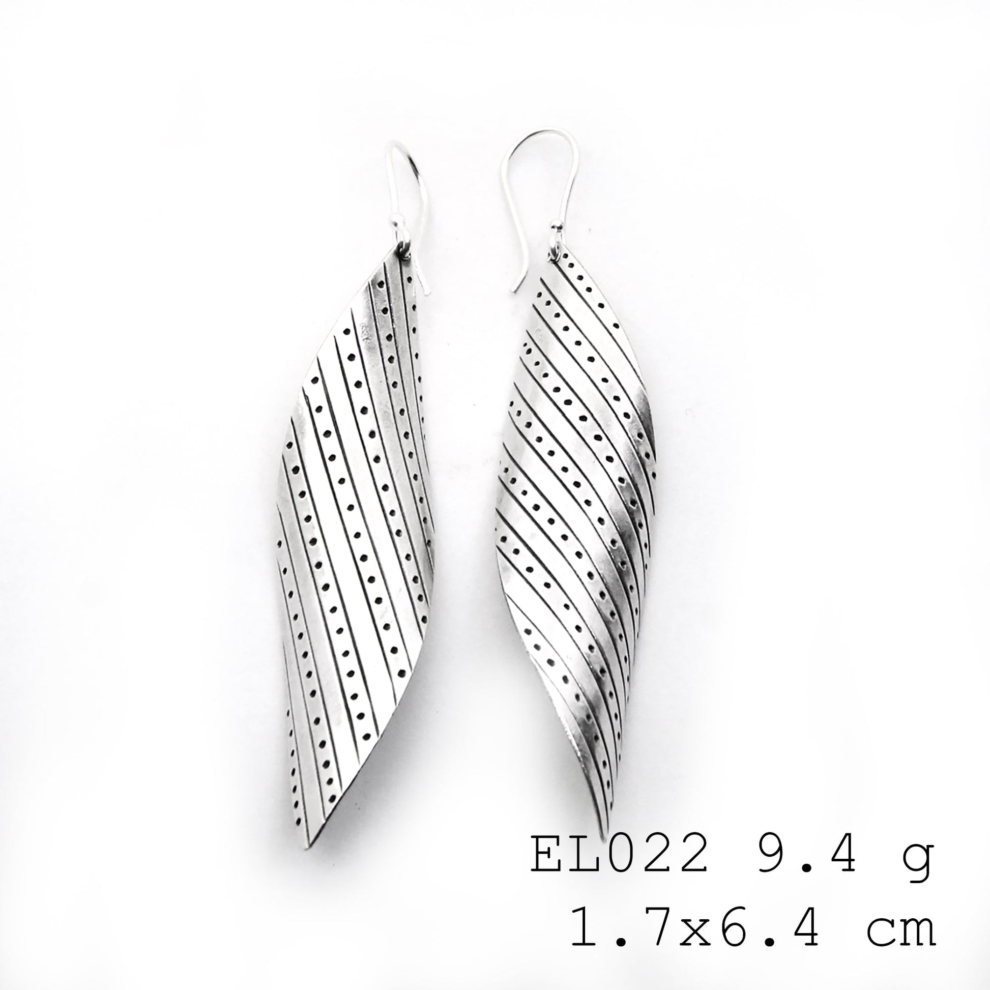 Artisan craftsmanship meets nature in these silver earrings.