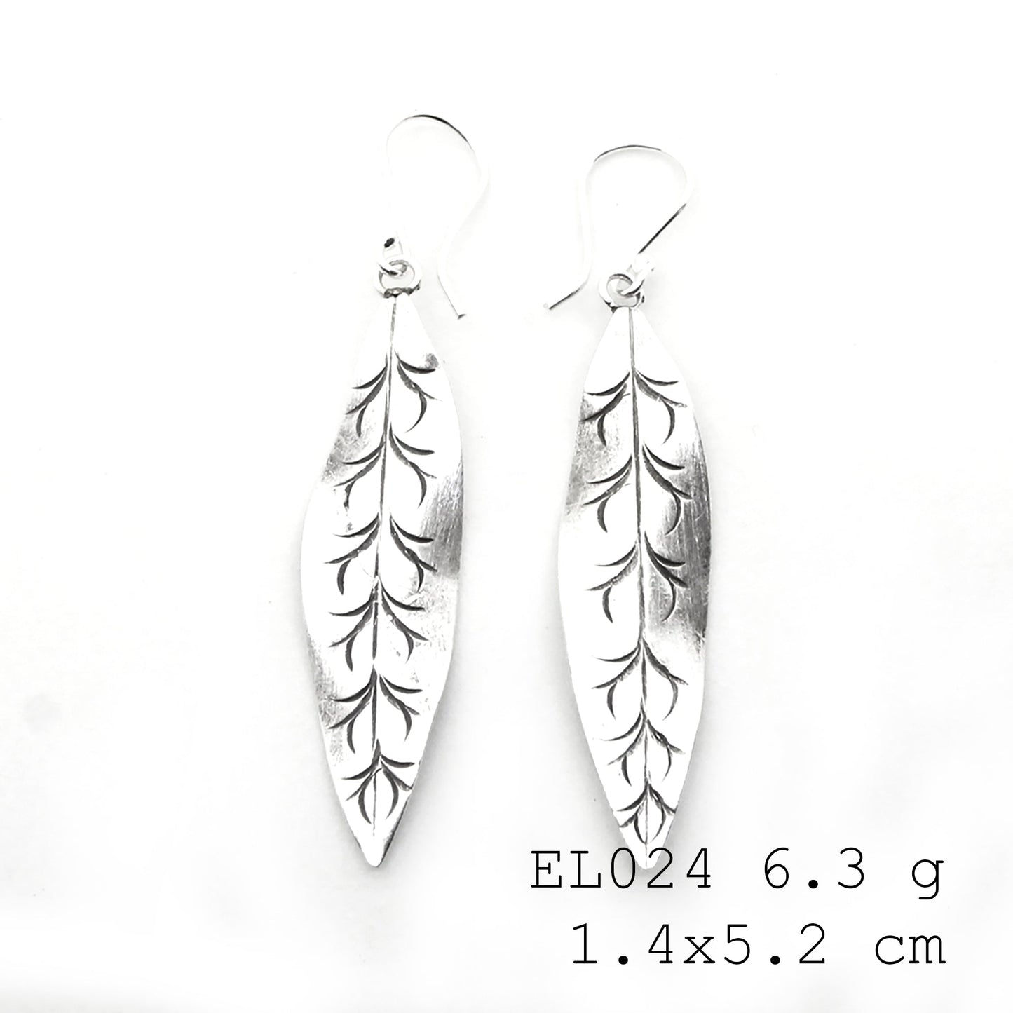 Nature-inspired beauty in these handmade silver earrings.