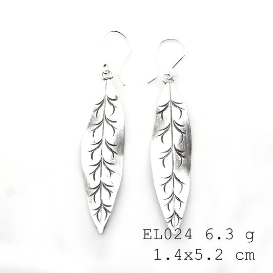 Nature-inspired beauty in these handmade silver earrings.
