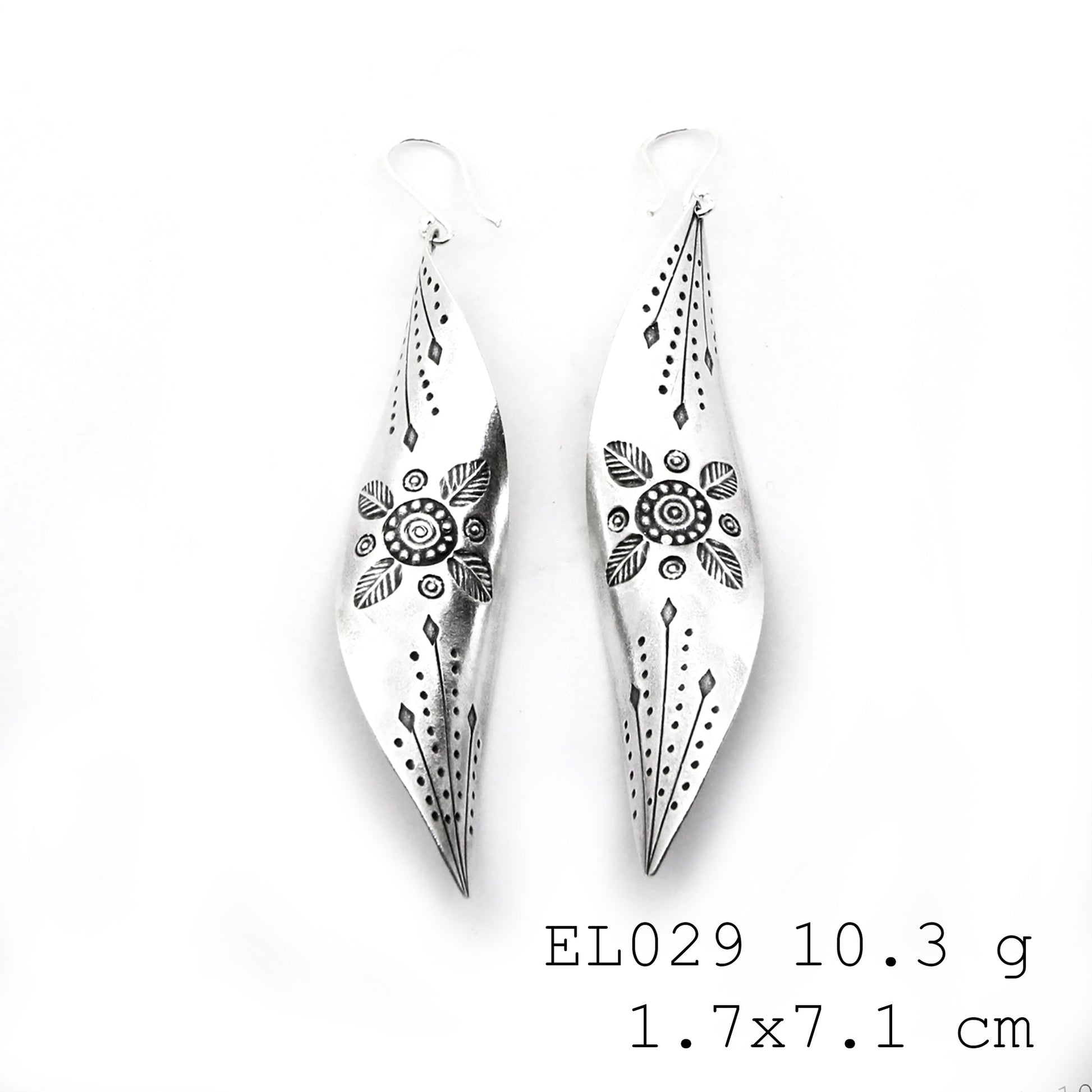 From the artisan’s bench: leaf-shaped silver earrings.