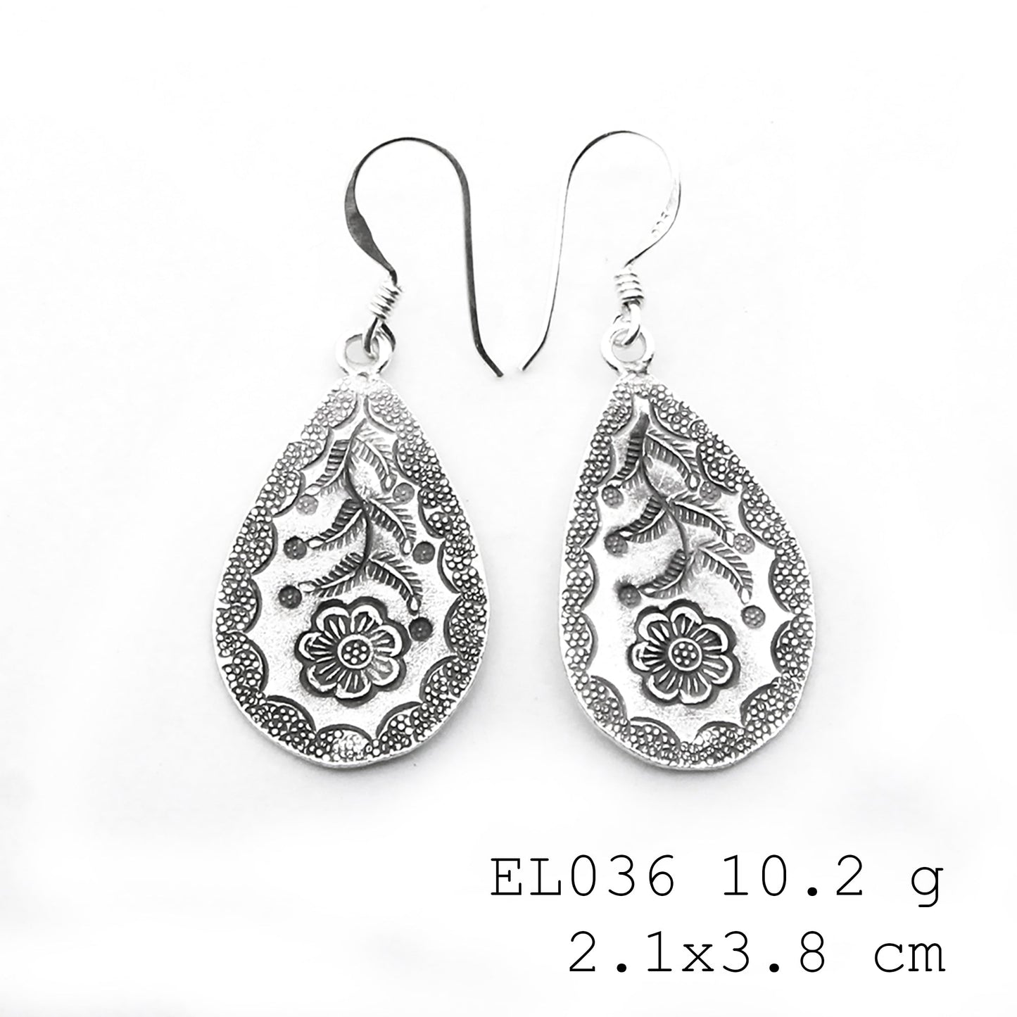 The perfect organic finish for these silver earrings.