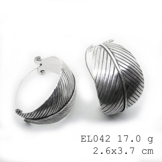 Intricate leaf patterns on our pure silver earrings.