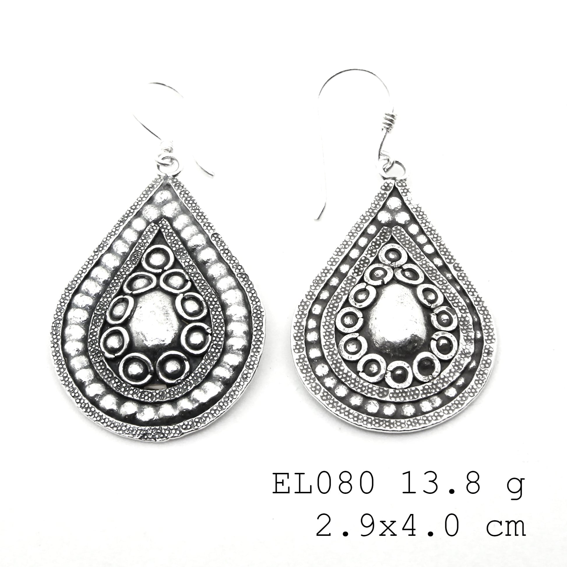 Expertly hammered leaf-shape silver earrings.