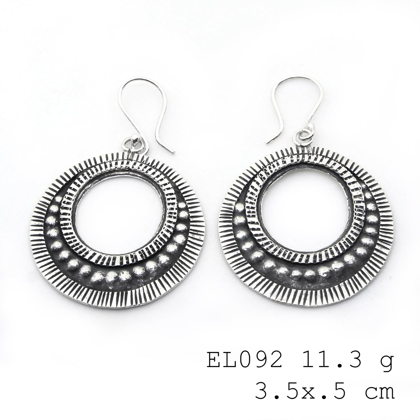 Polished to perfection: leaf-shape silver earrings.