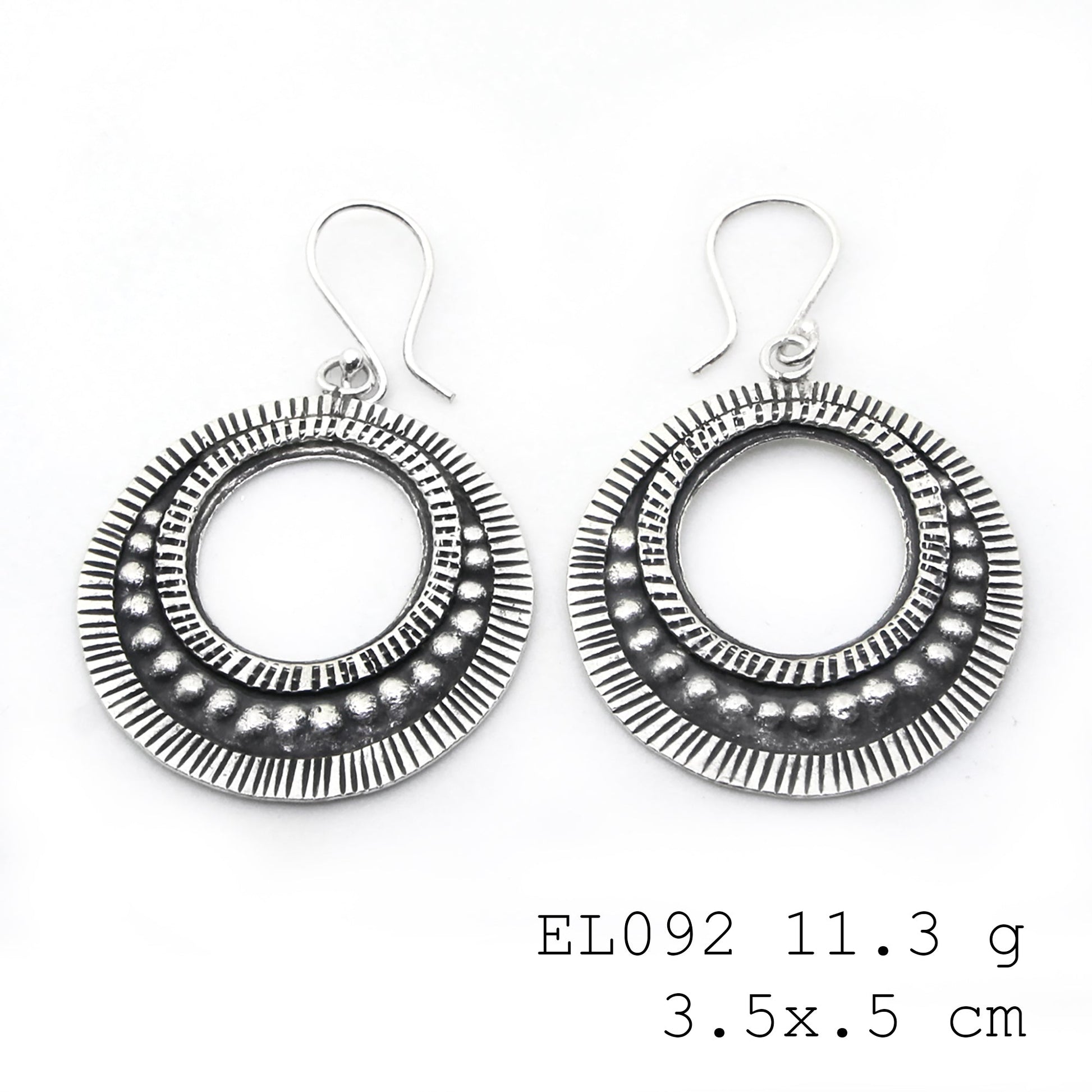 Polished to perfection: leaf-shape silver earrings.