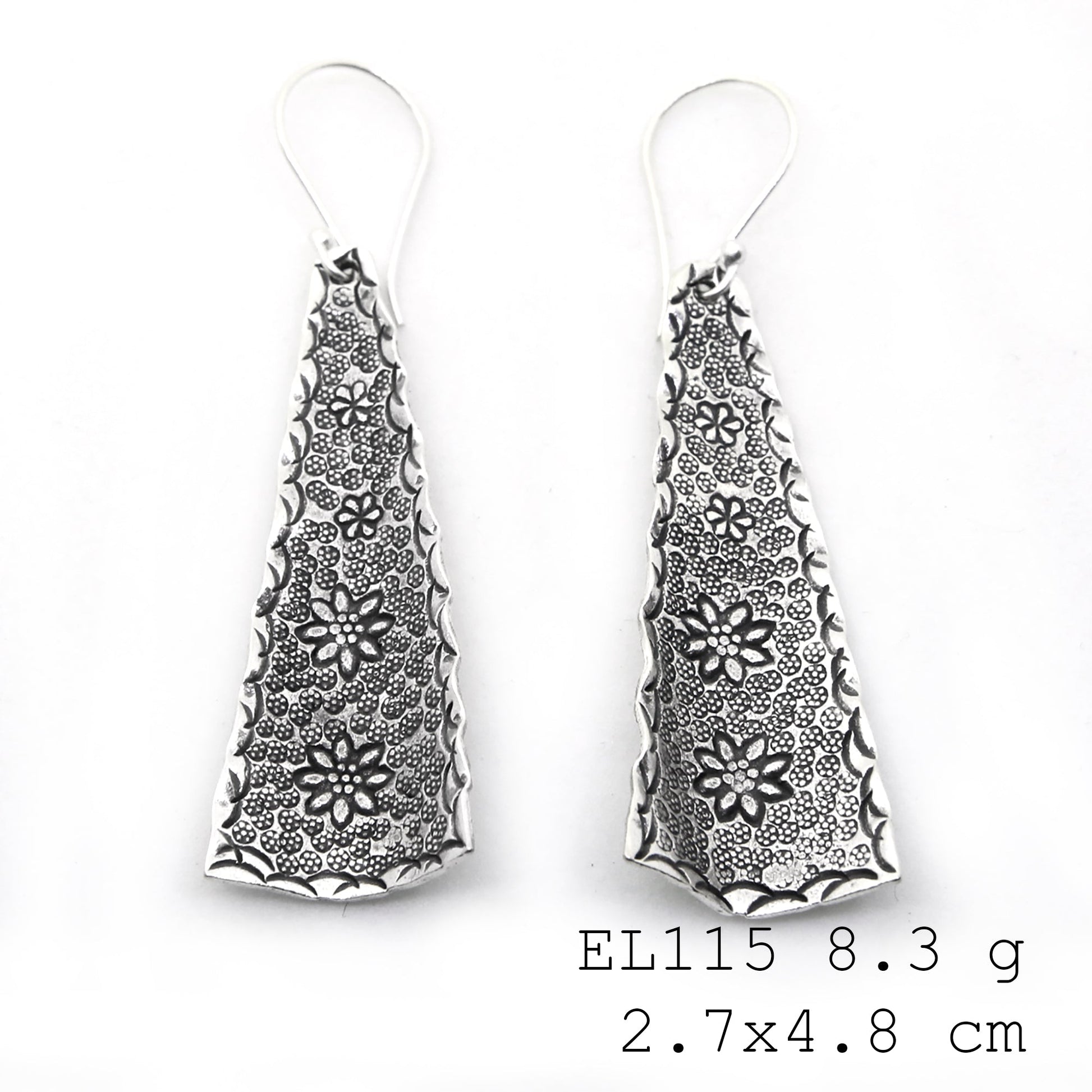 Elegant botanical style in handmade silver earrings.