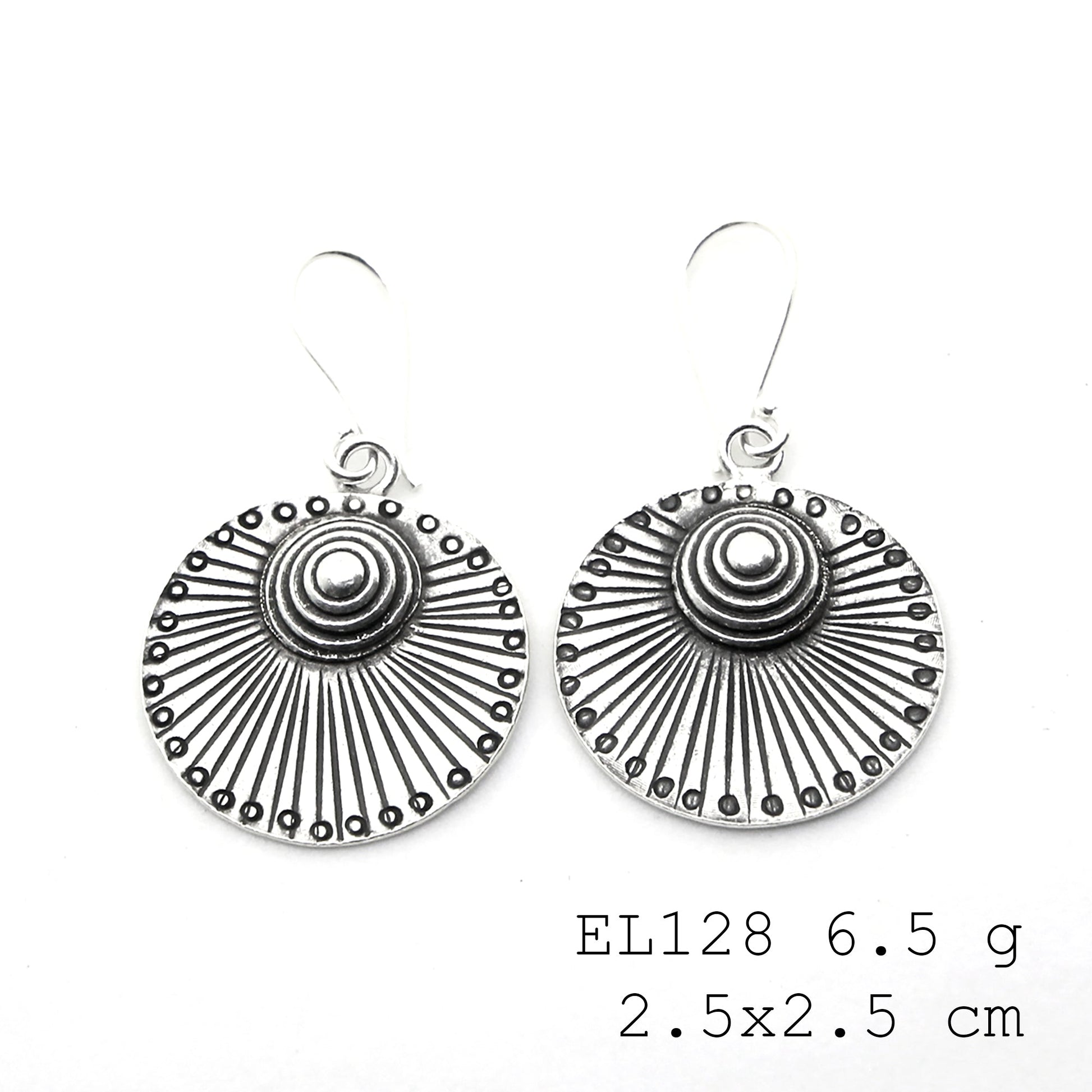 Sculpted by hand: leaf-style silver earrings.