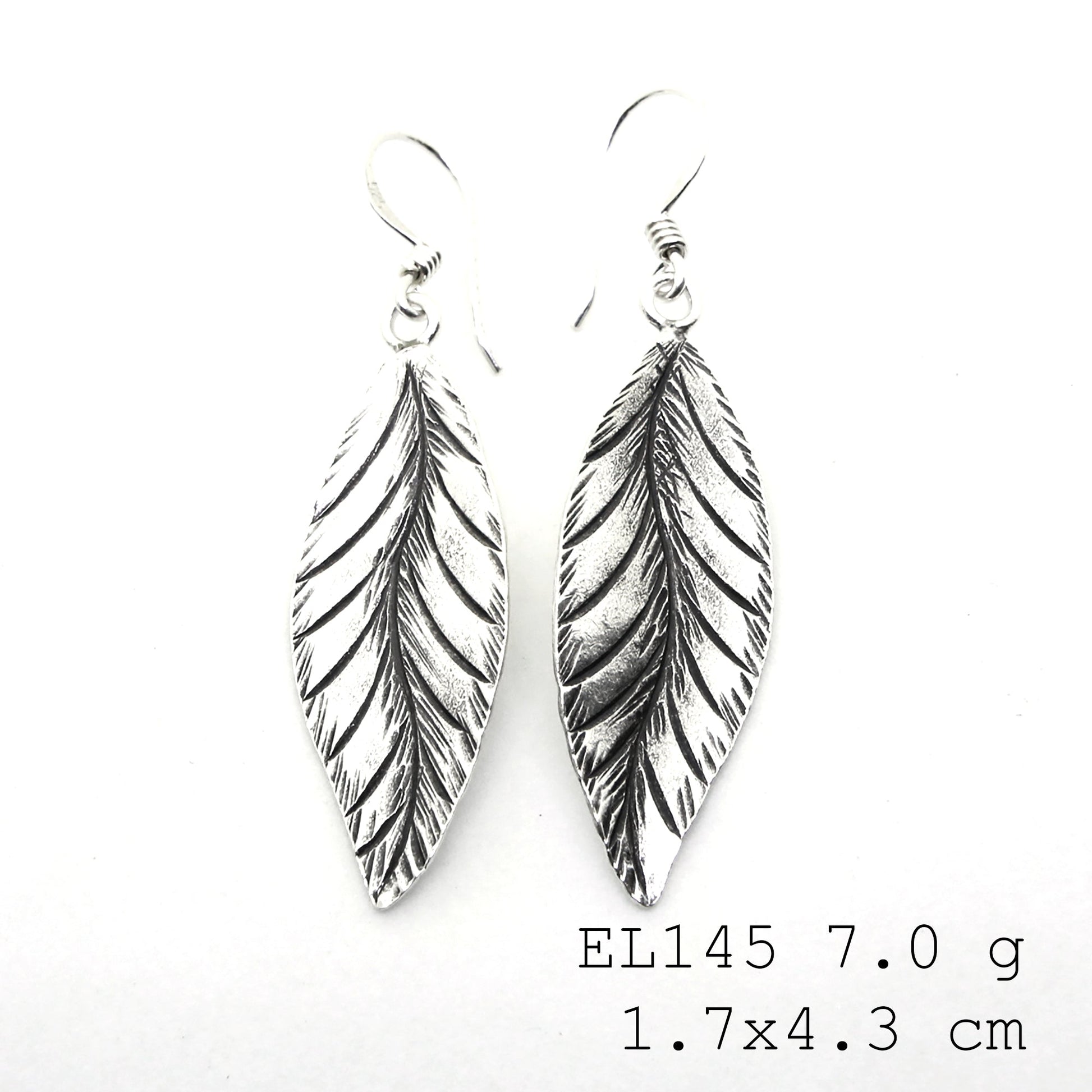 Capturing nature’s grace in silver earrings.