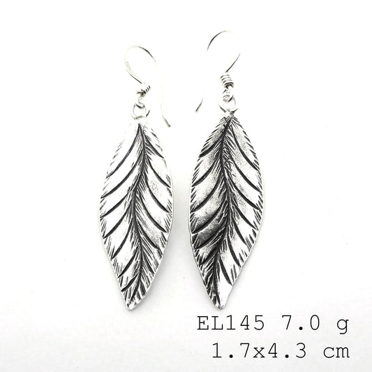 Capturing nature’s grace in silver earrings.