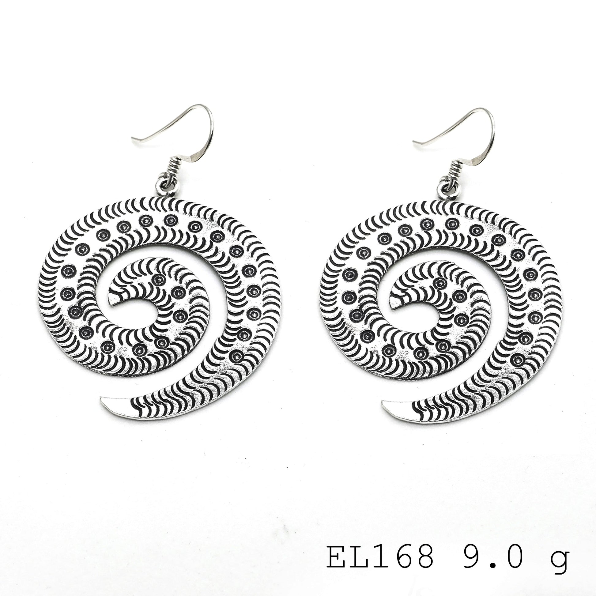 A leaf-inspired masterpiece: handmade silver earrings.