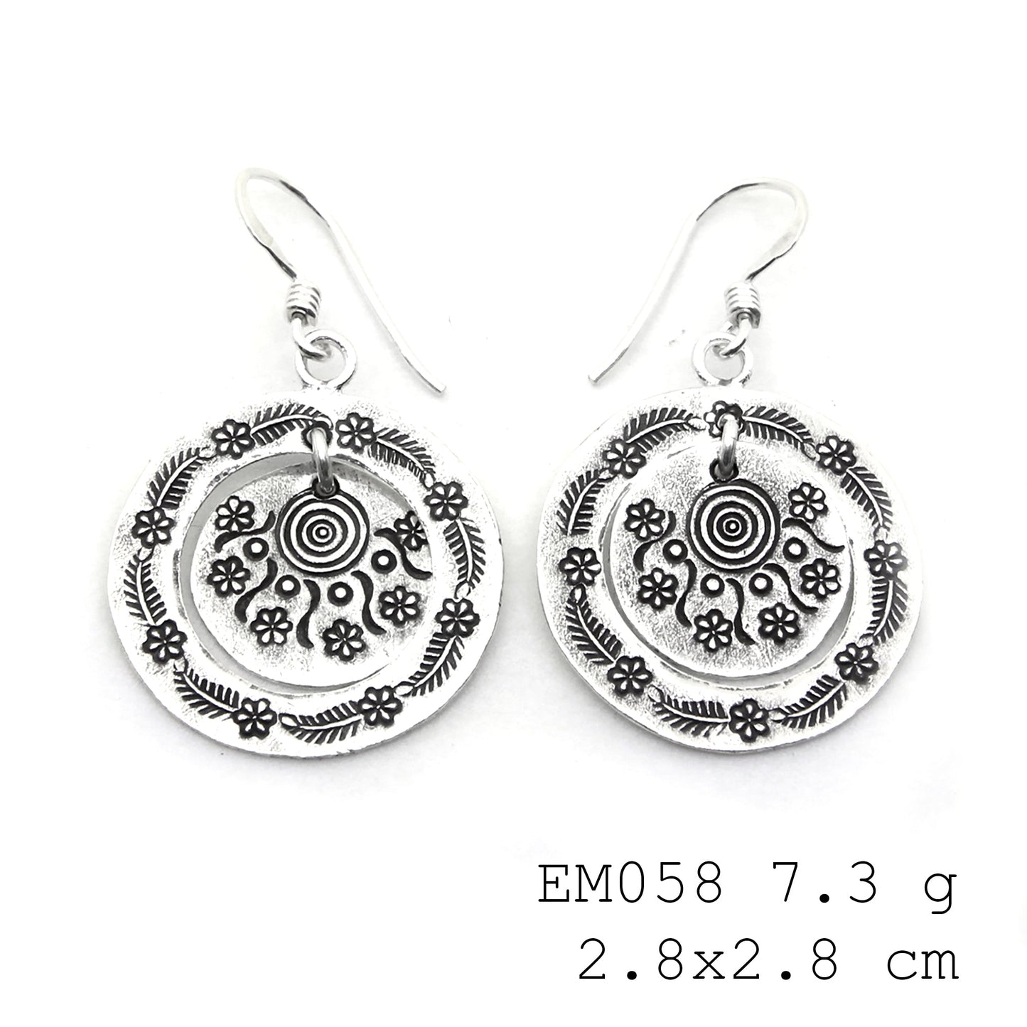 From day to night in these handmade silver earrings.