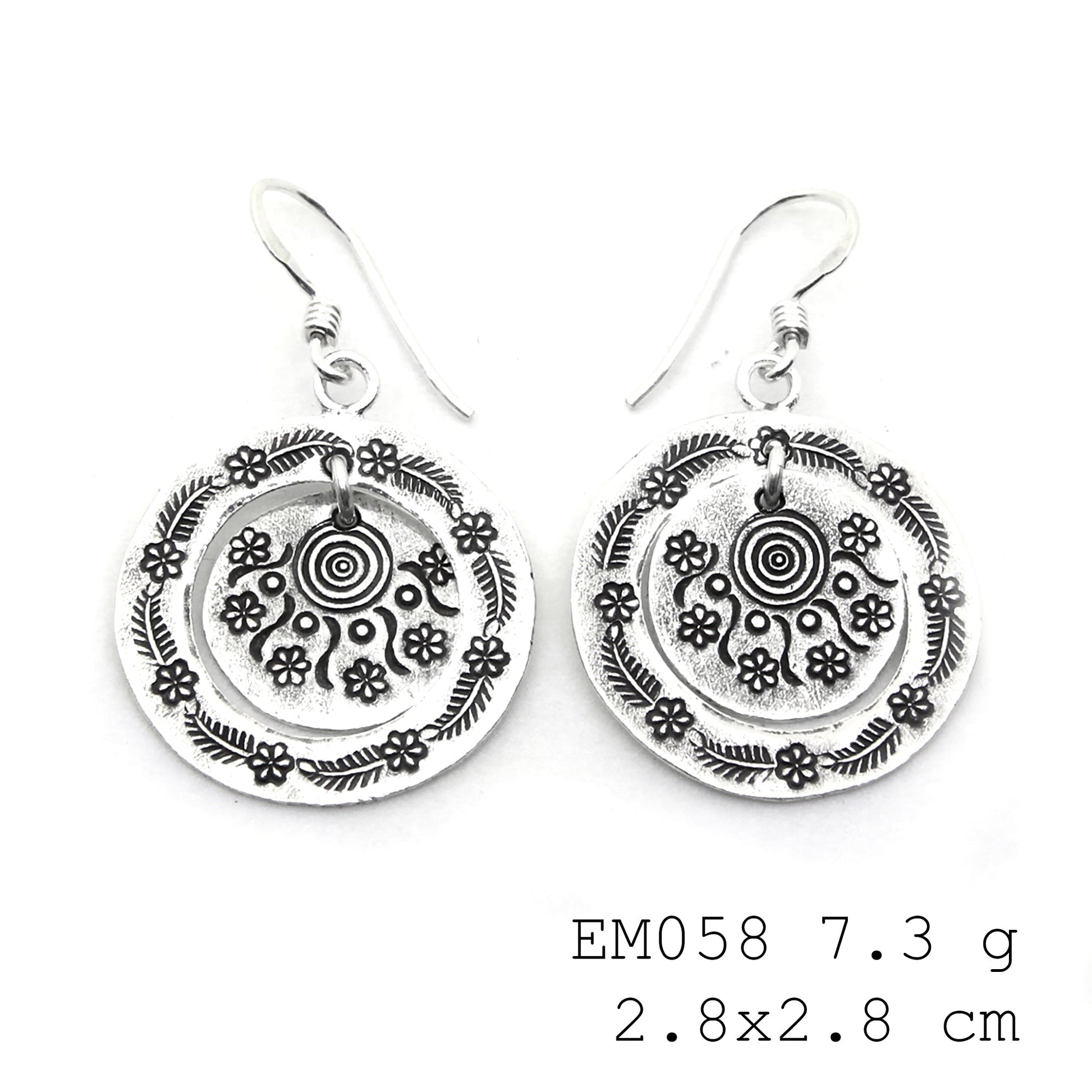 From day to night in these handmade silver earrings.