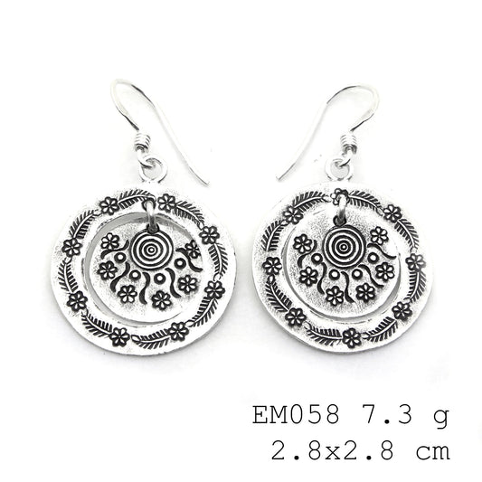 From day to night in these handmade silver earrings.