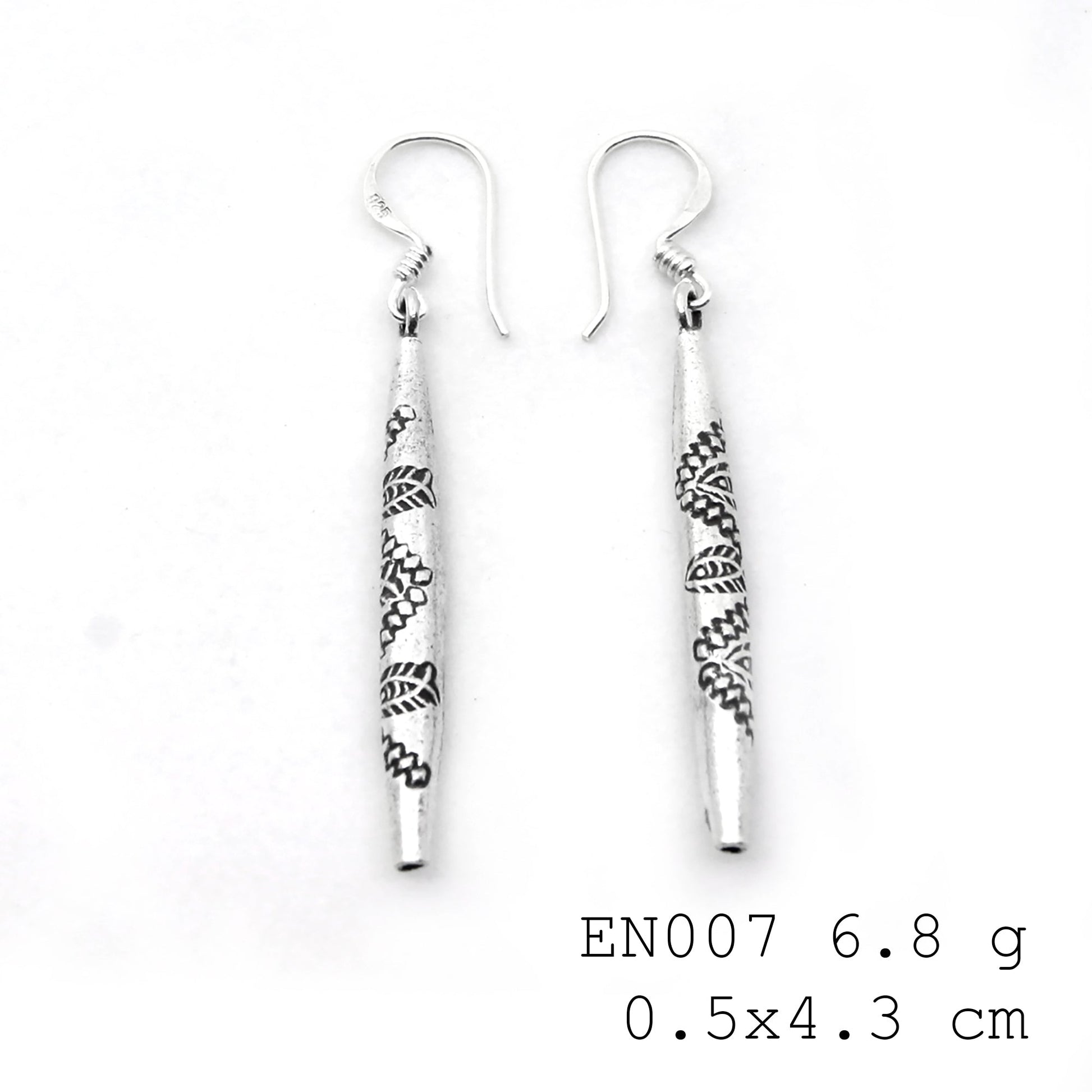 Art you can wear. Elevate your style with these unique silver earrings.