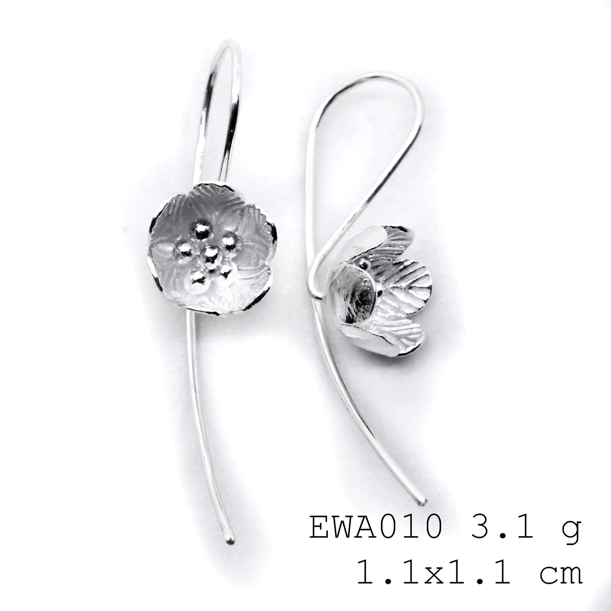 Artisan-crafted 98% pure white flower silver earrings.
