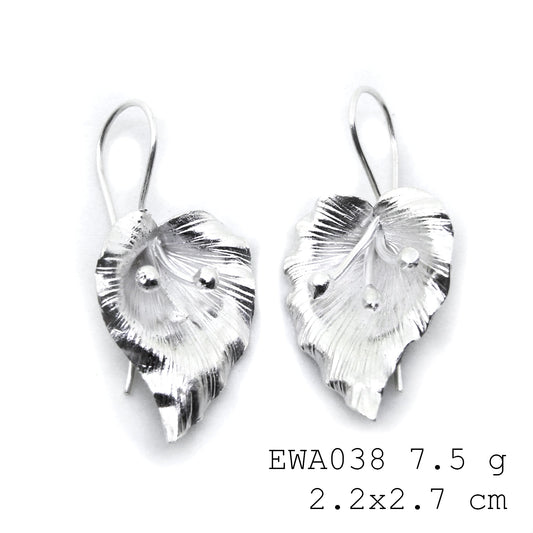 Every outfit needs these handmade white flower silver earrings.