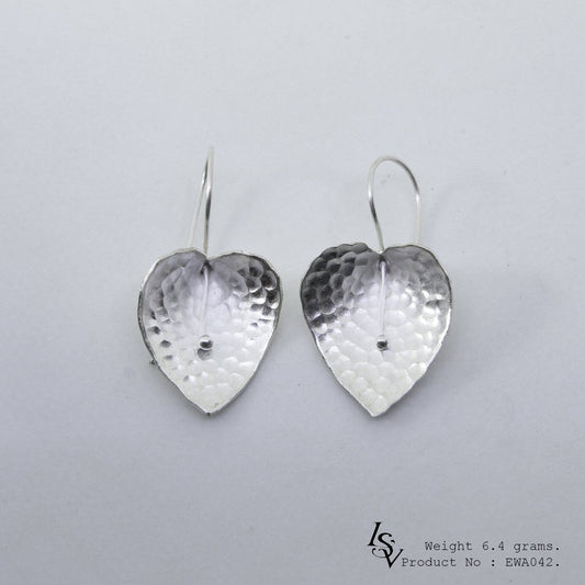 Floral magic in these handmade silver earrings.