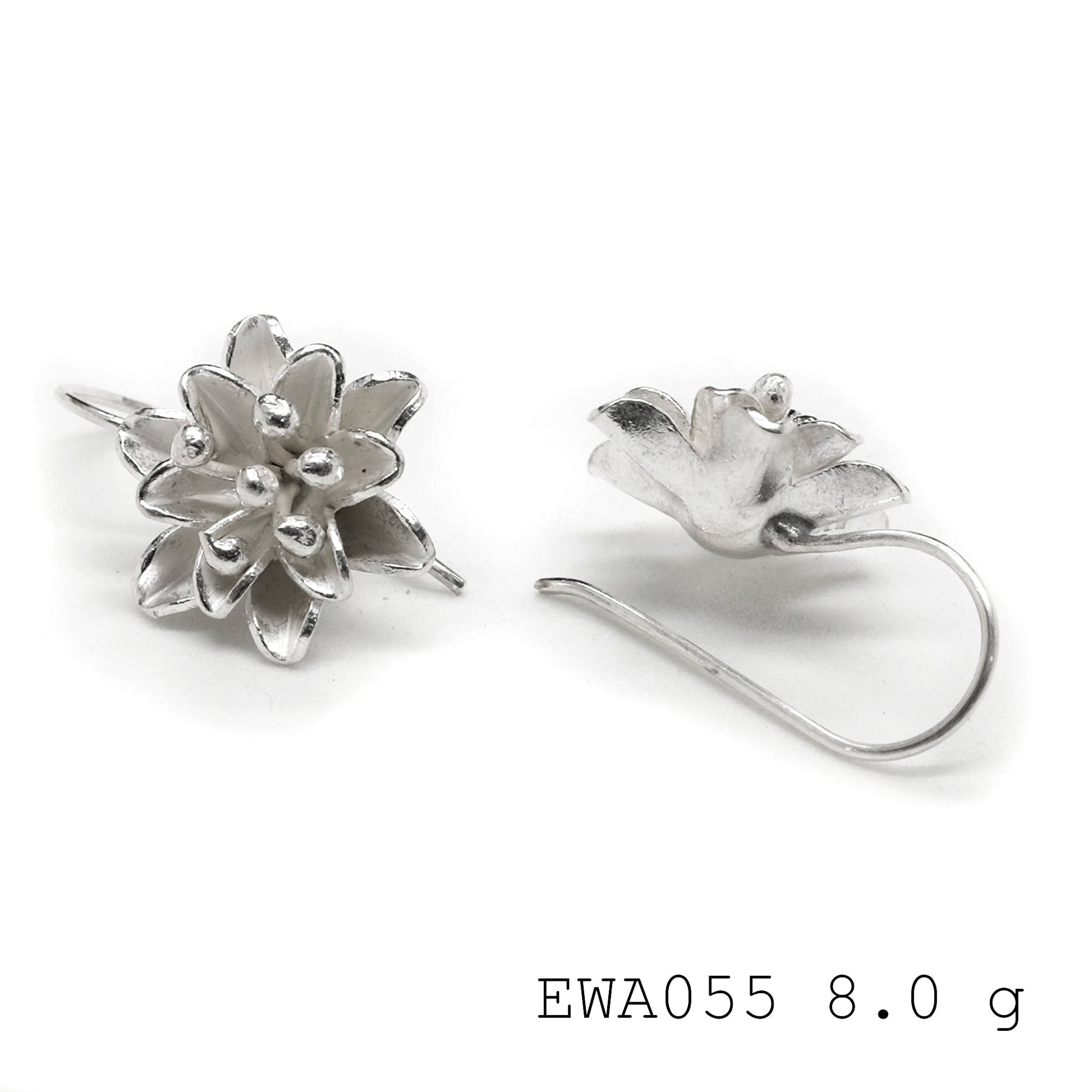 Make a statement in our white flower 98% silver earrings.
