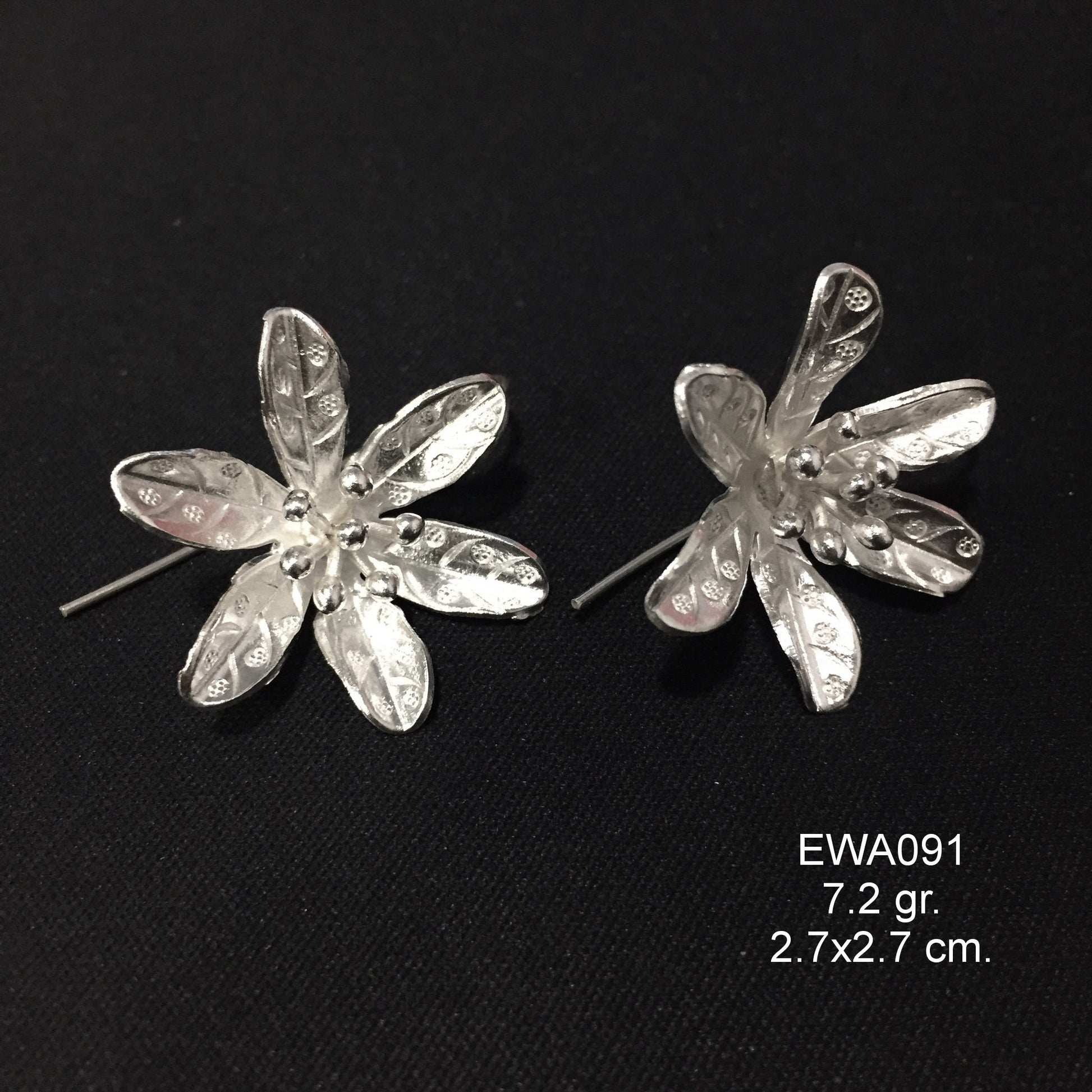 Sophistication starts with these white flower silver earrings.