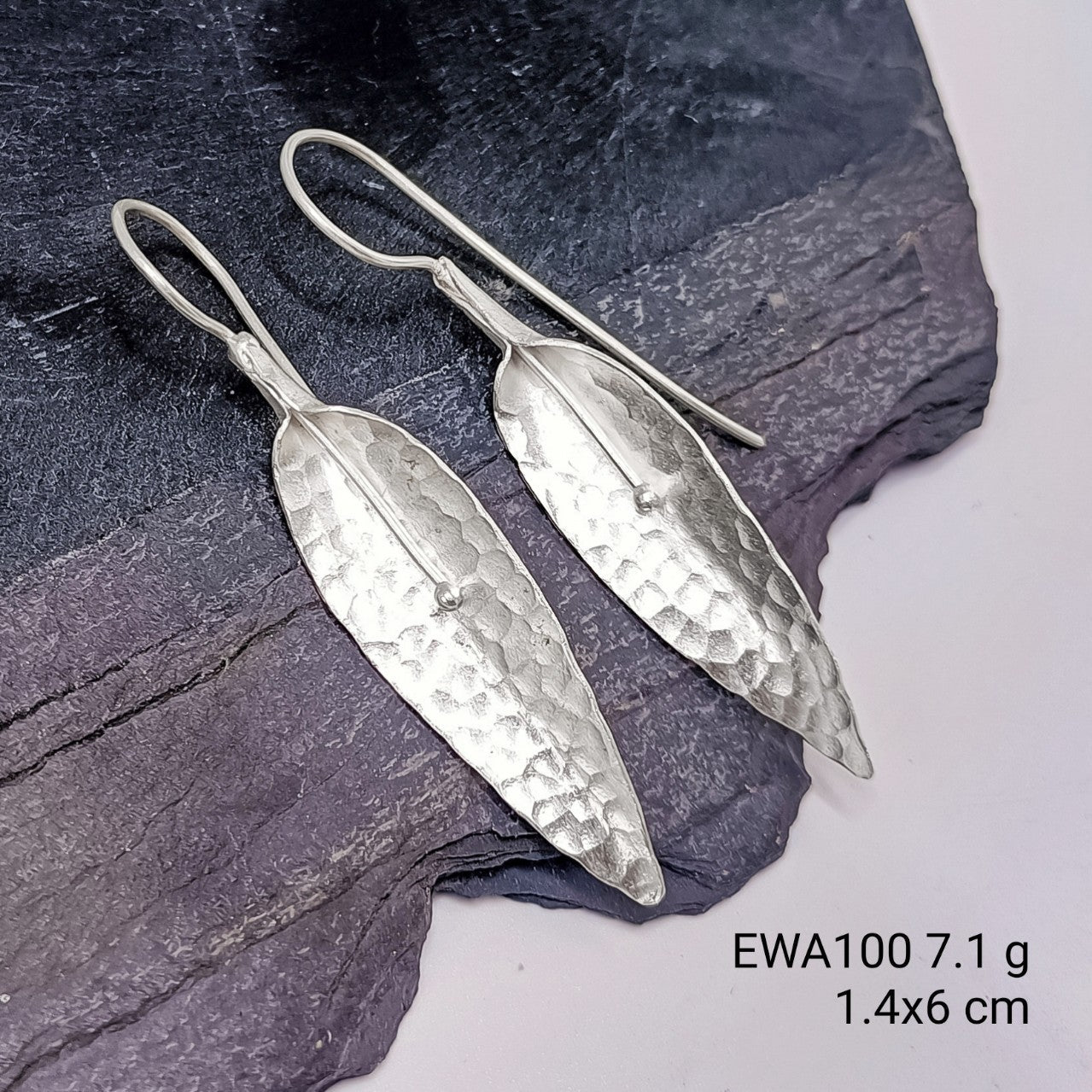 Experience luxury with our handmade white flower silver earrings.
