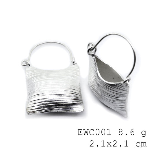 Pure 98% silver luxury in a unique bag shape: Shop silver earrings.