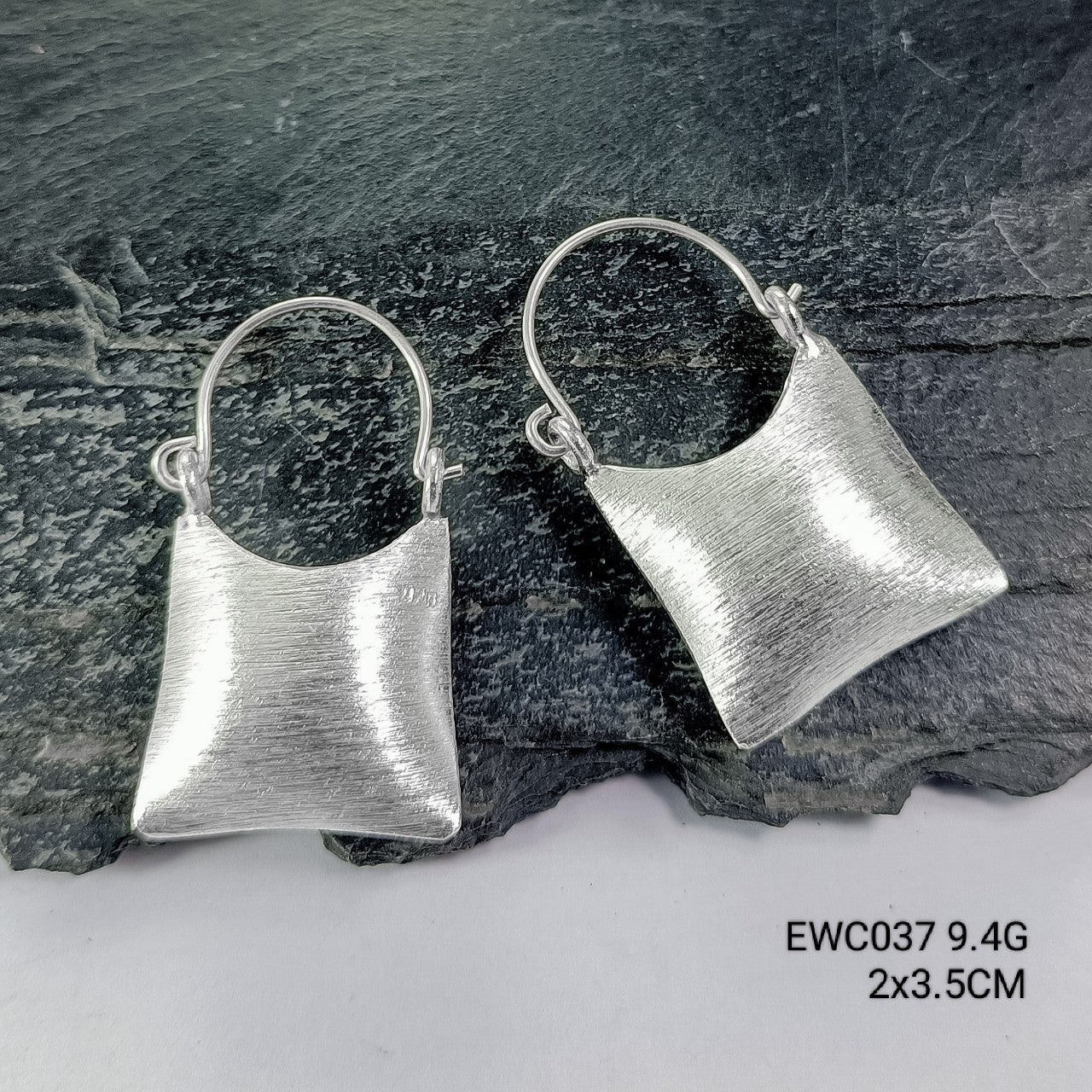 Tiny bags, big style! Grab these handmade bag silver earrings.
