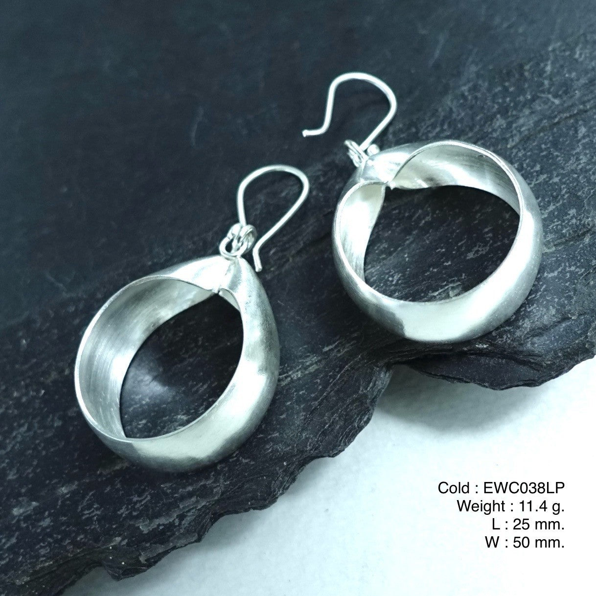 The cutest accessory ever! Shop our white bag shape silver earrings.