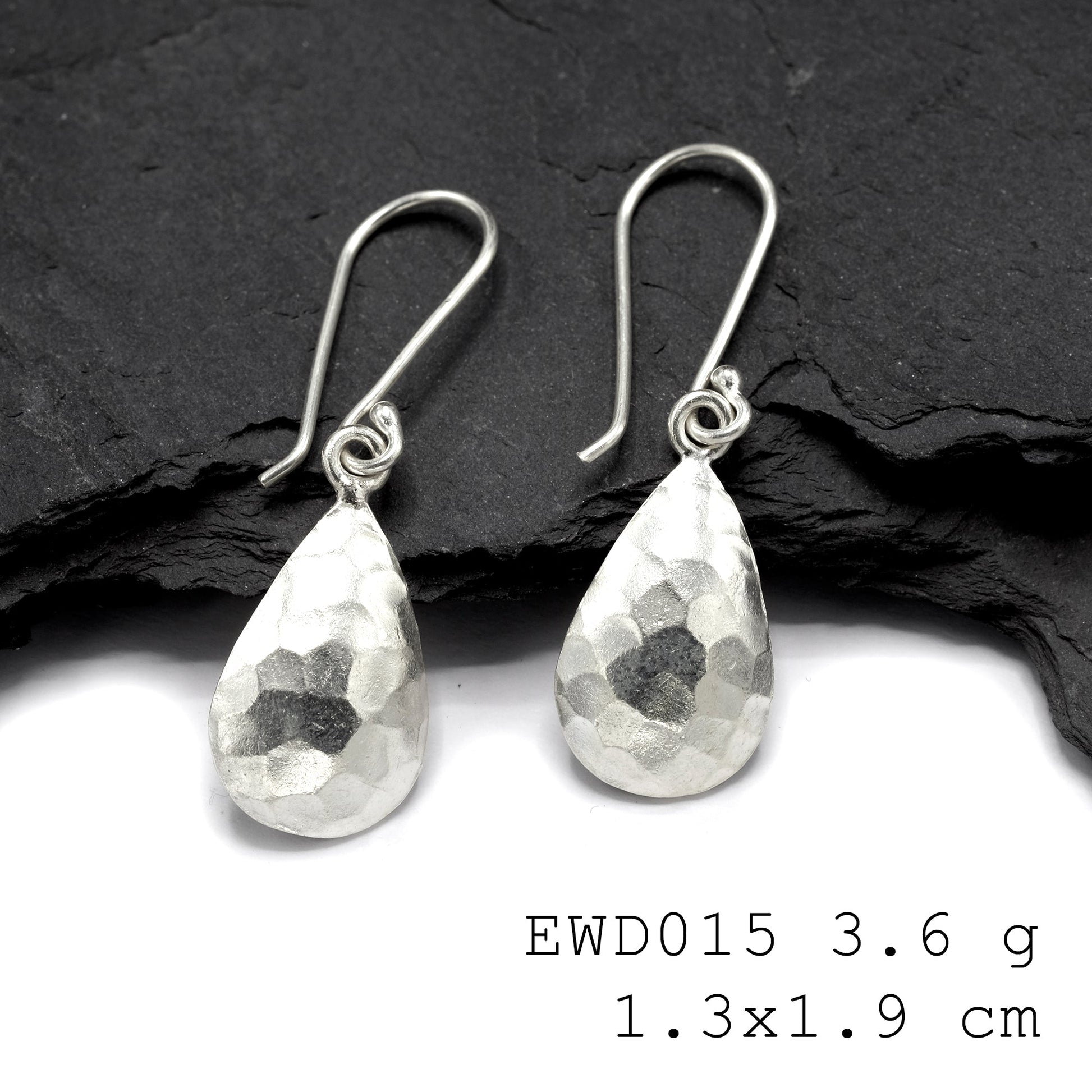 Elevate your look instantly with these white funnel silver earrings.