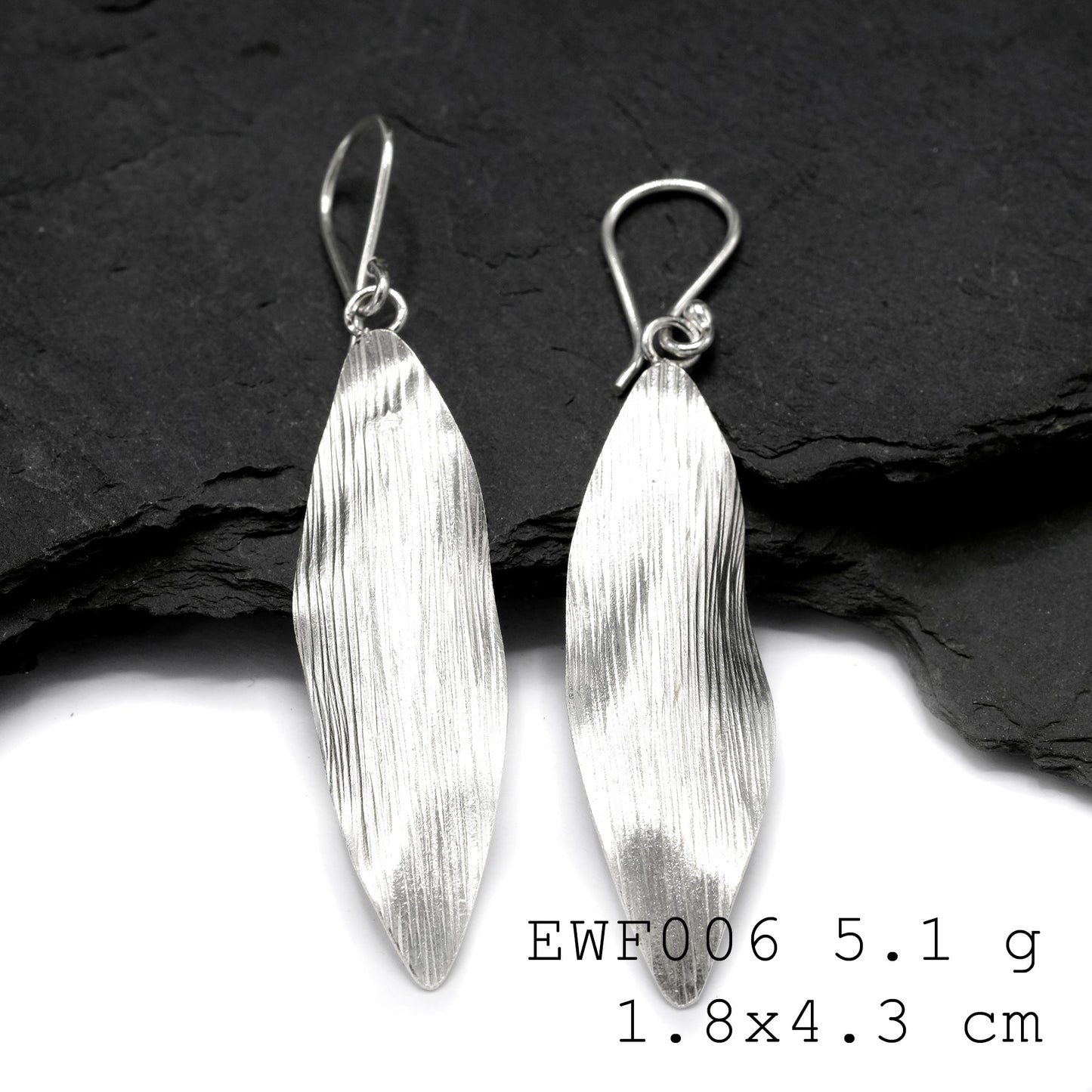 Minimalist magic: White sheet shape silver earrings.