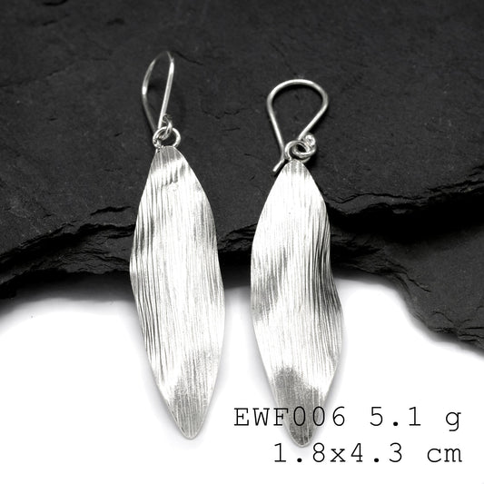 Minimalist magic: White sheet shape silver earrings.