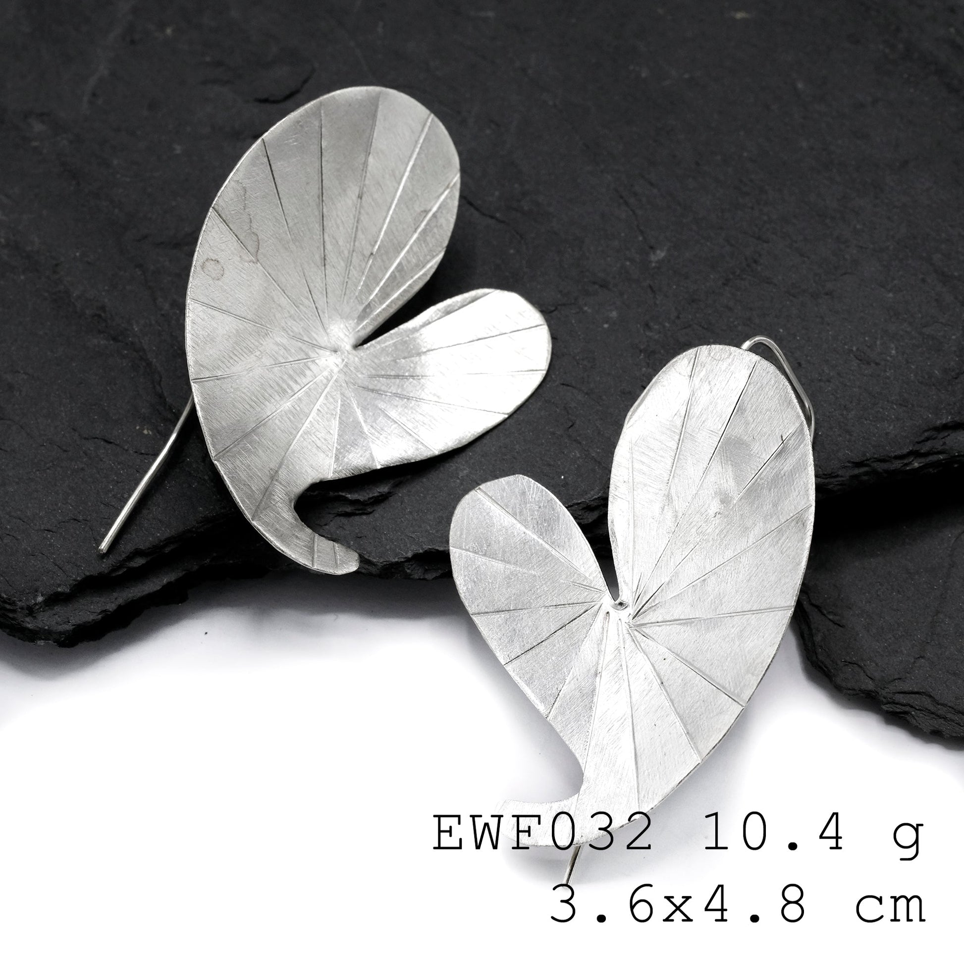 Shop the white sheet collection: silver earrings.