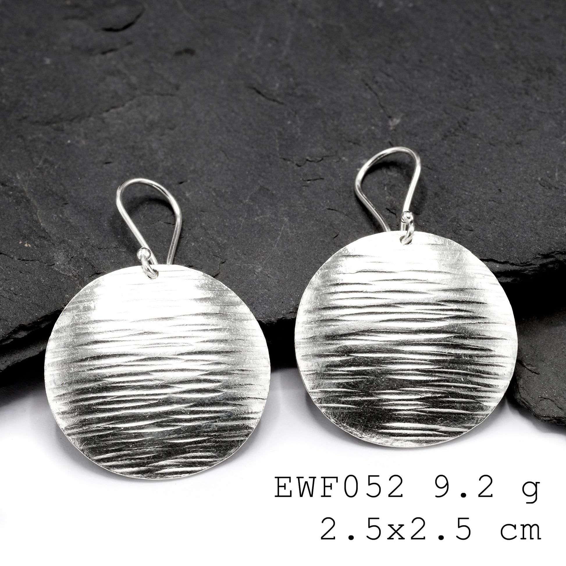 One-of-a-kind white sheet shape silver earrings.