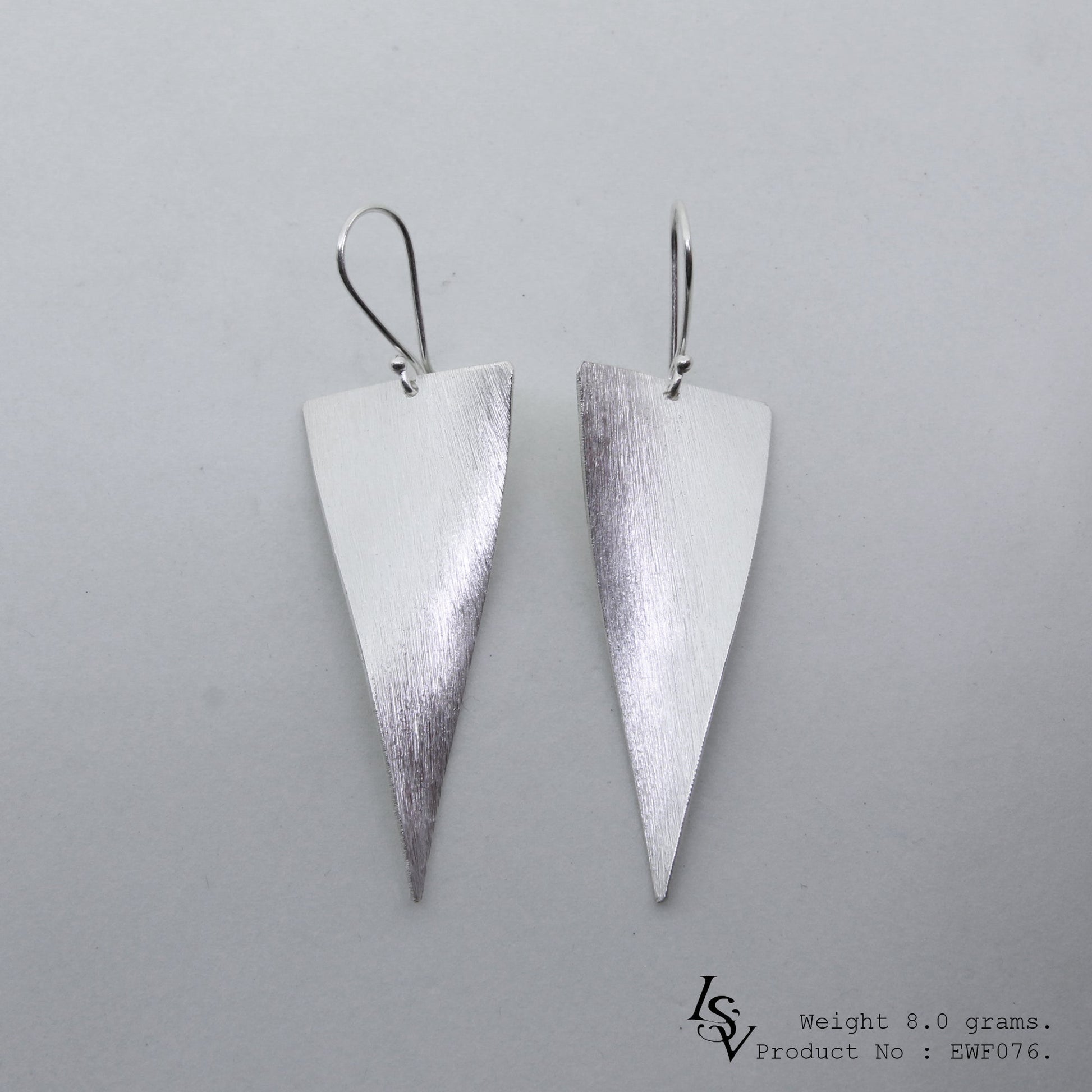 Elegance redefined with white sheet silver earrings.
