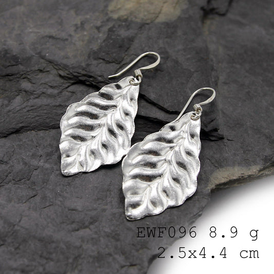 Glow up with these handmade silver earrings.