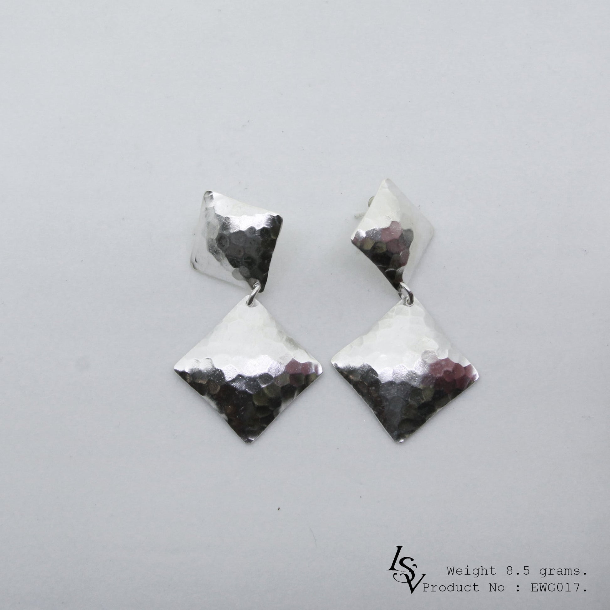 Hand-forged 98% pure silver: Shop our two-layer silver earrings.