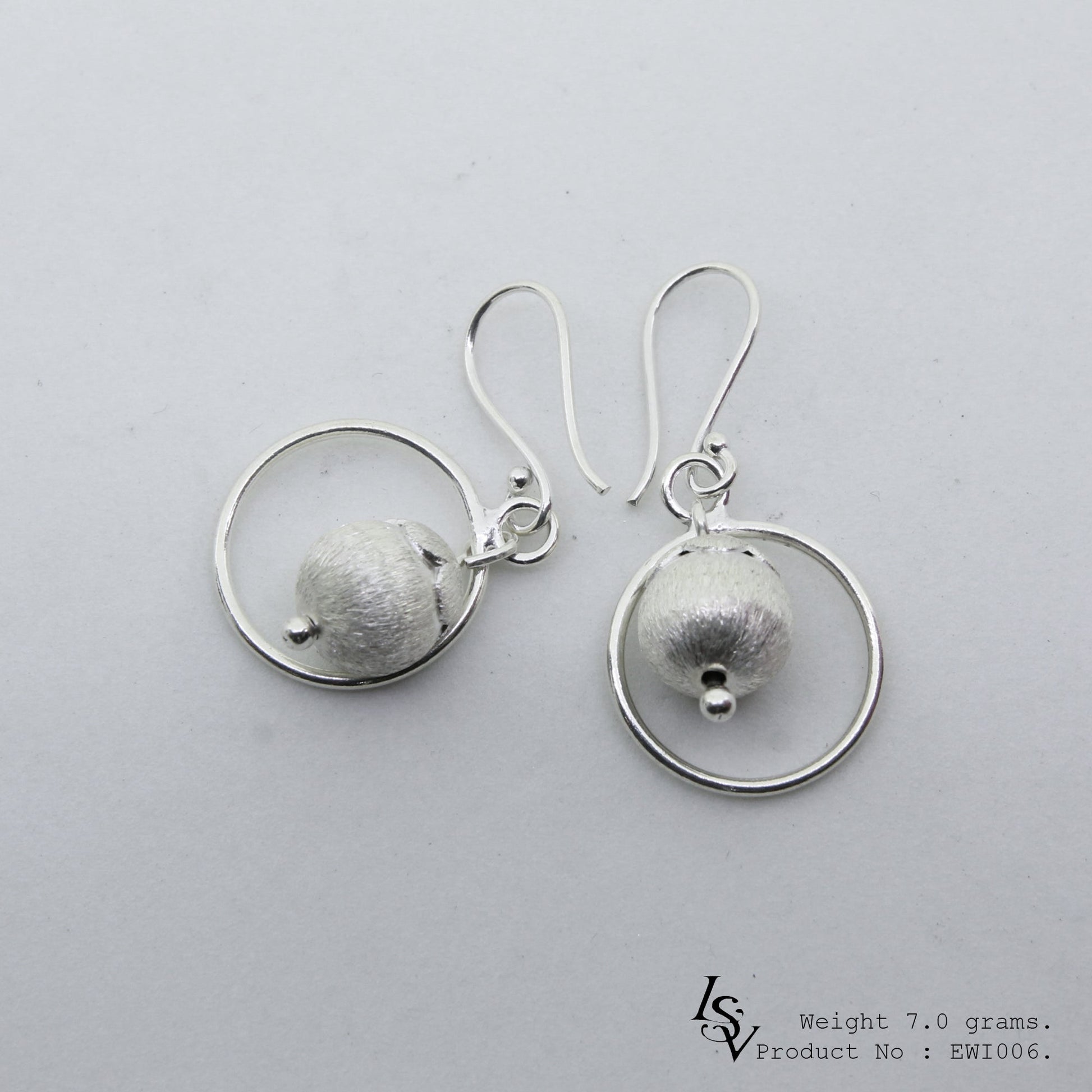 Minimalist must-have: Handmade white ball silver earrings.