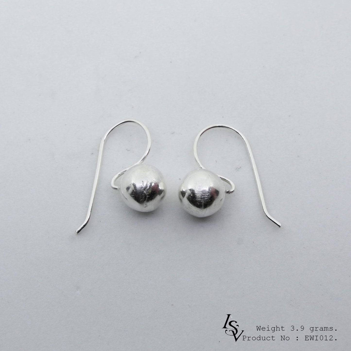 Elegant and timeless white ball shape silver earrings.