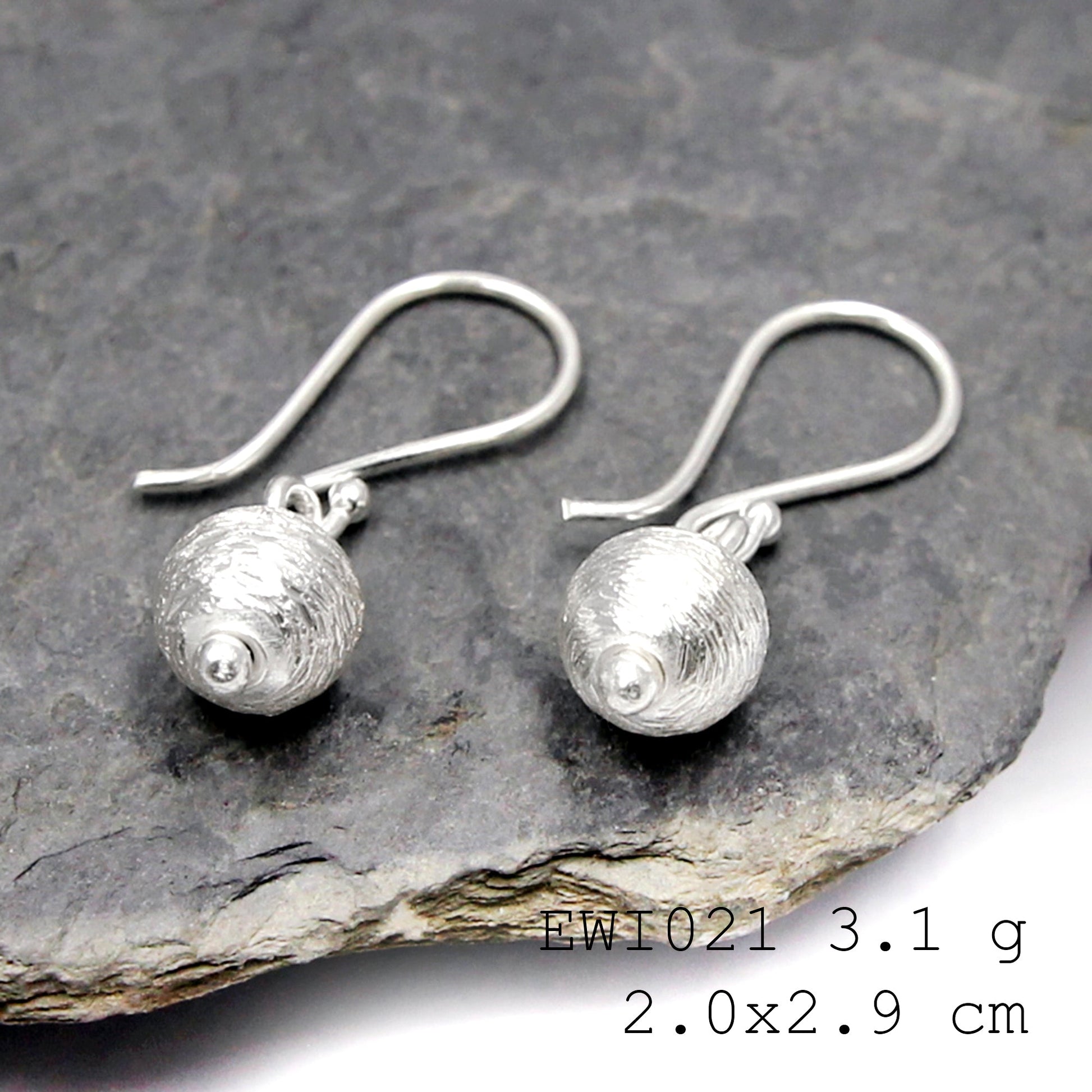 Simple. Bold. Pure. Our white ball shape silver earrings.