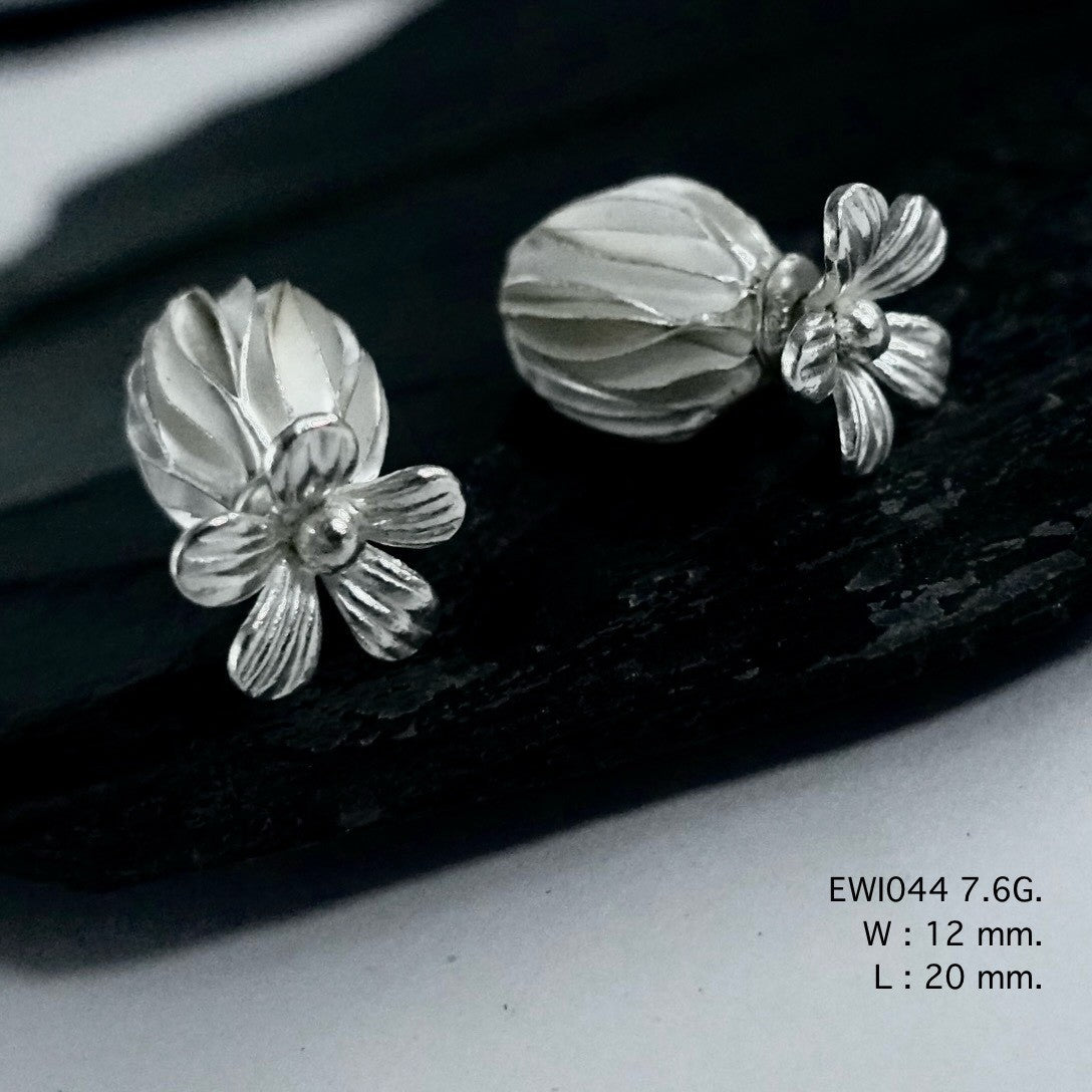 The viral jewelry find: Handmade white ball silver earrings.