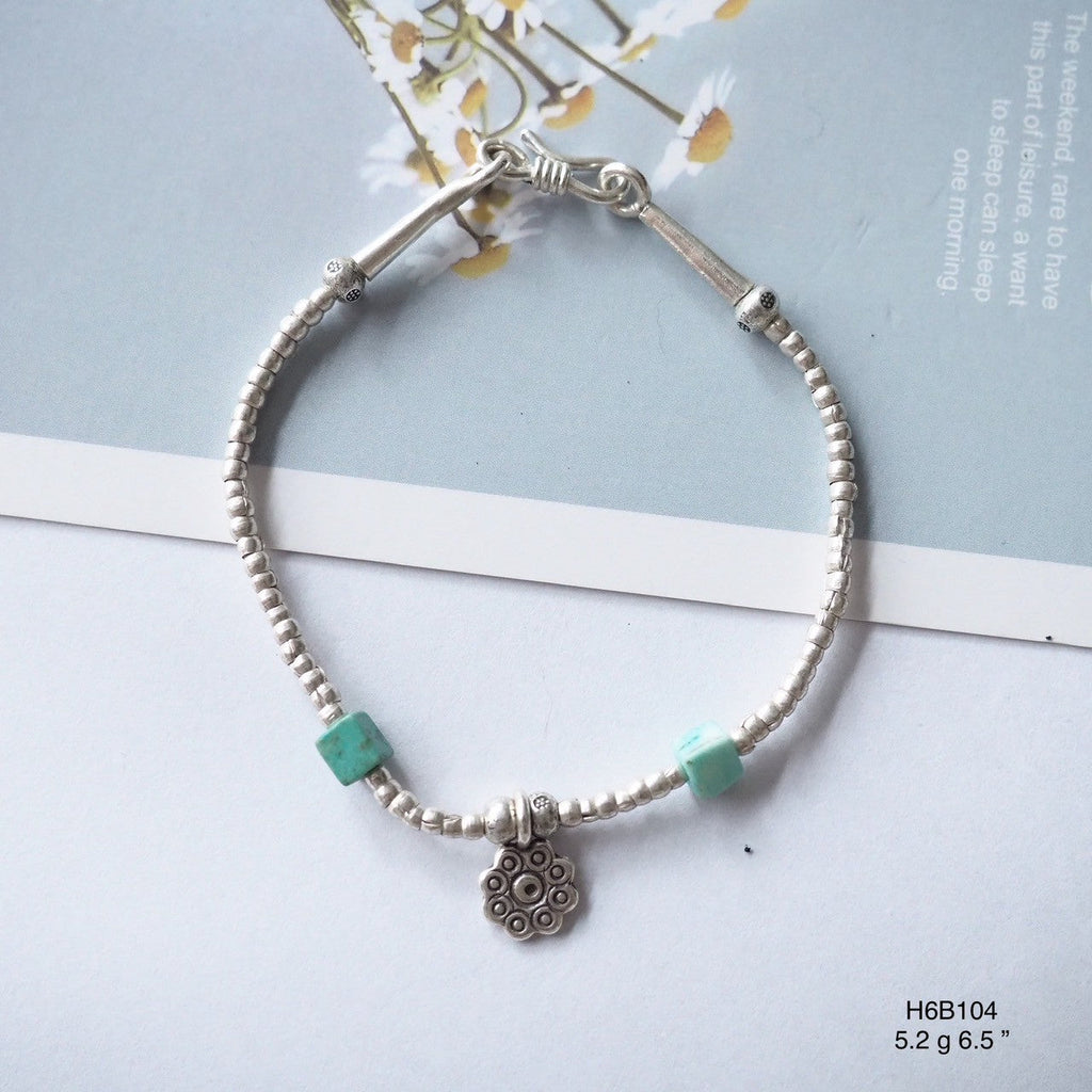 Elevate your wrist game with this high-purity silver bracelet.