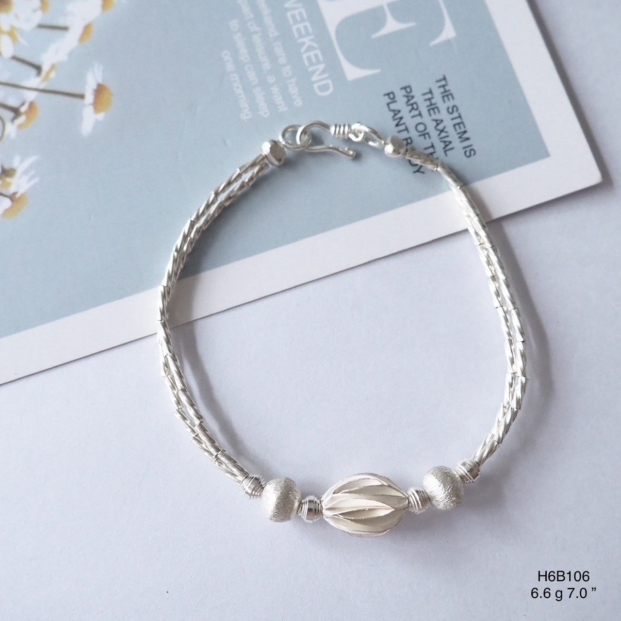 The brightest glow comes from a 98% silver bracelet.