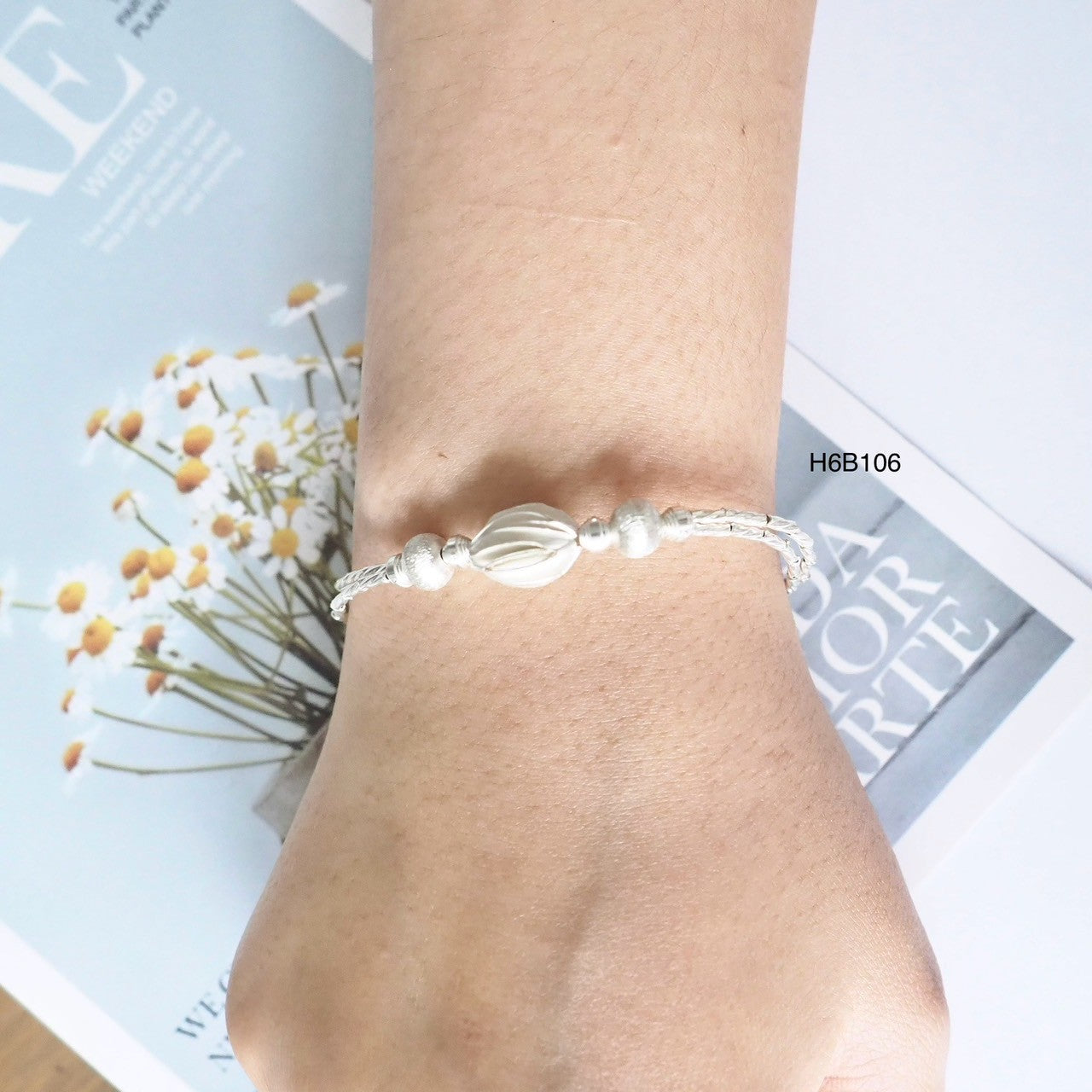 The brightest glow comes from a 98% silver bracelet.