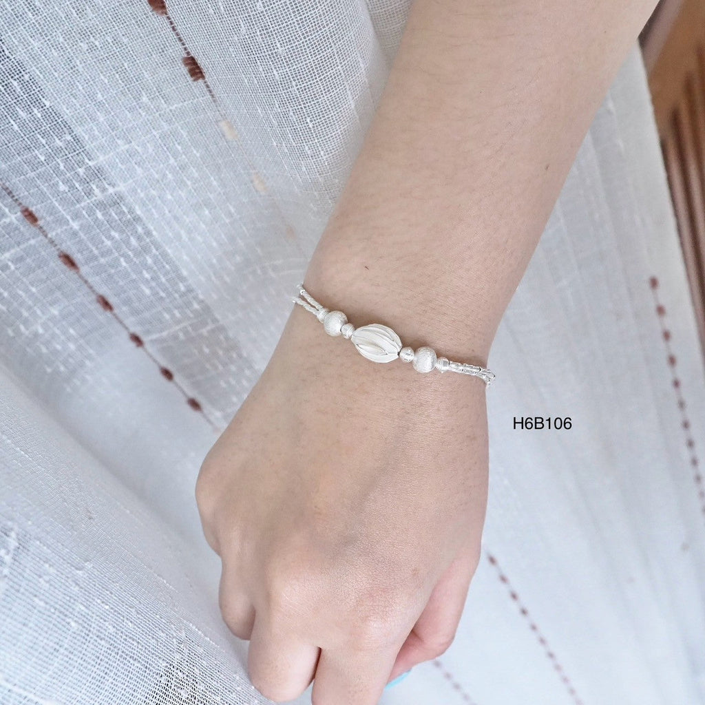 The brightest glow comes from a 98% silver bracelet.