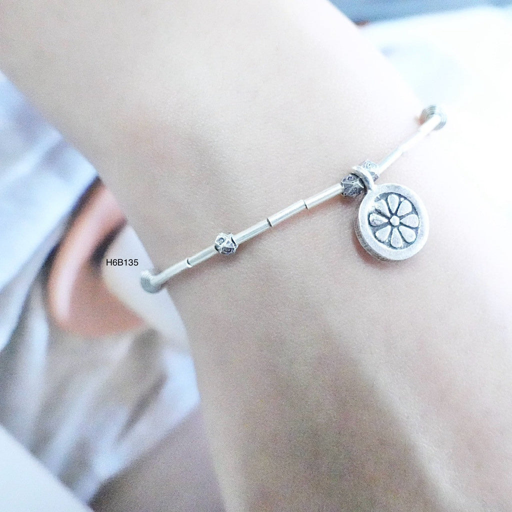 Minimalist vibes with this high-purity silver bracelet.