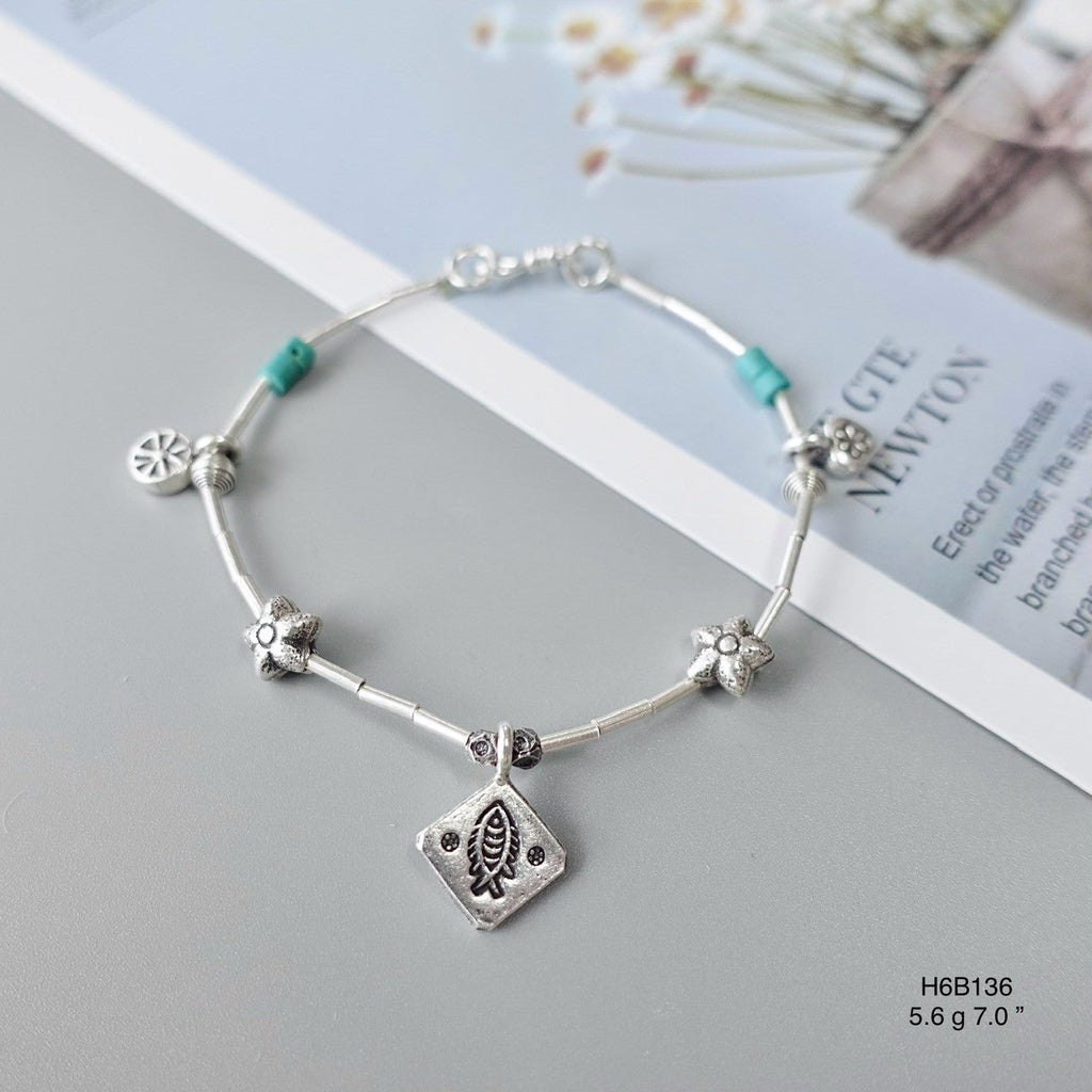 Make a statement with our handcrafted silver bracelet.