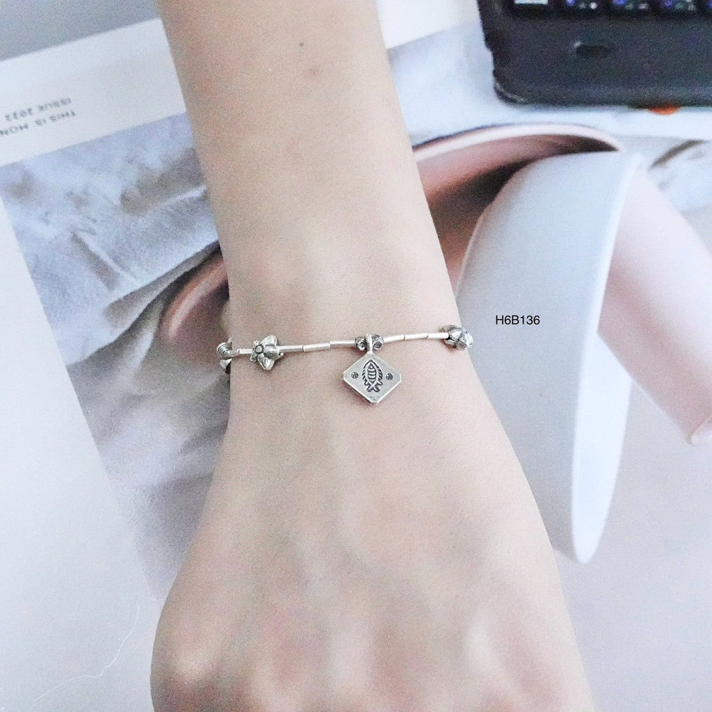 Make a statement with our handcrafted silver bracelet.
