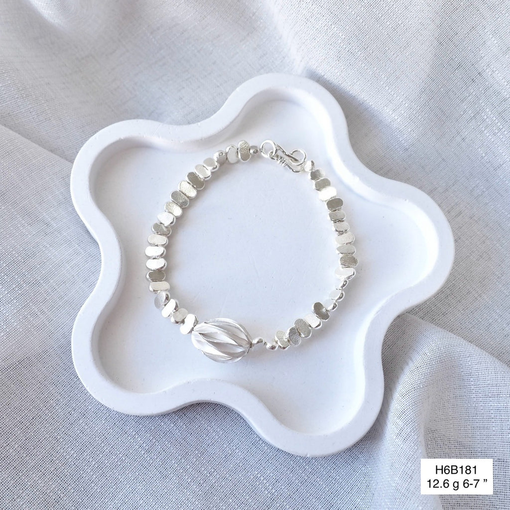 Support authentic Thai artisans with this handmade silver bracelet.