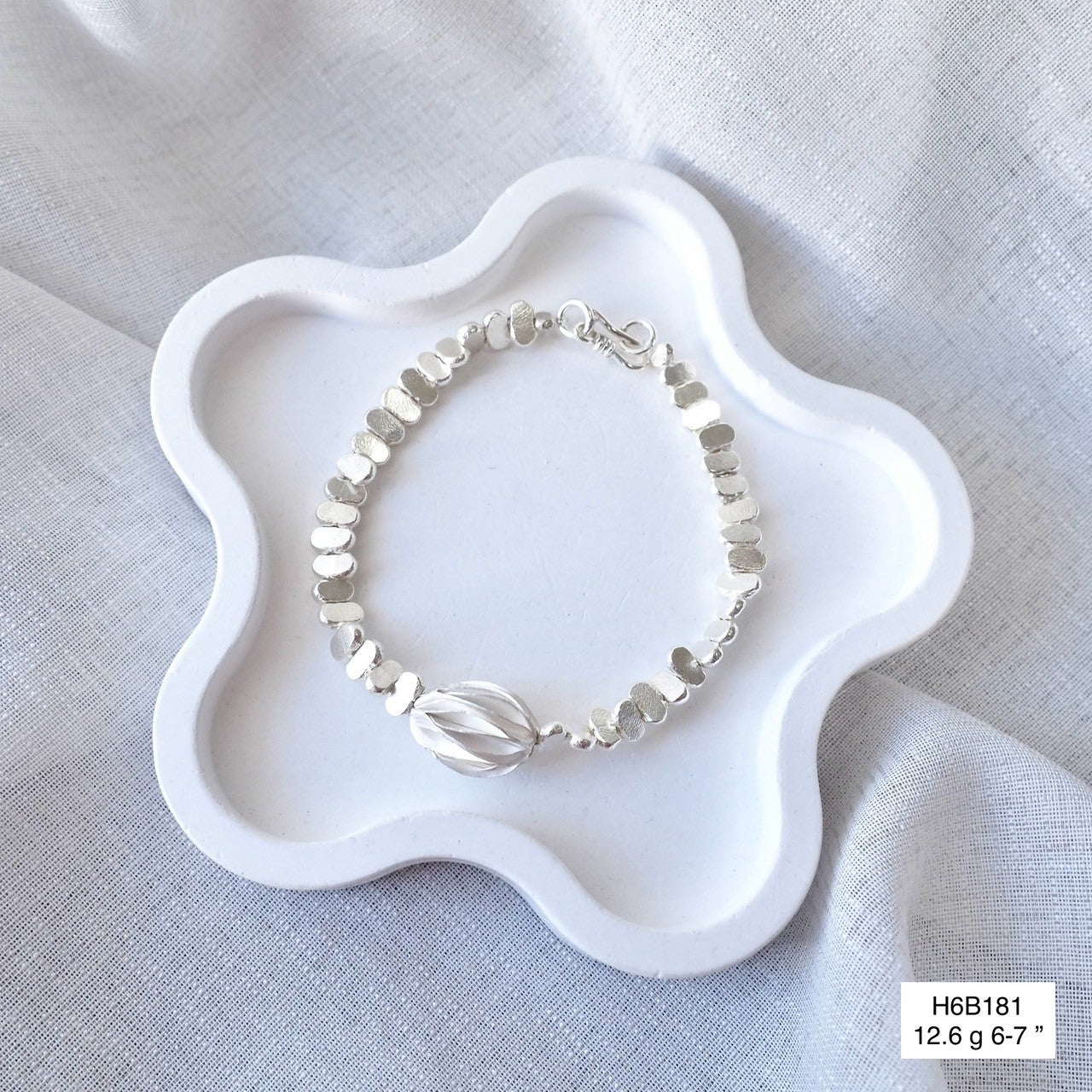 Support authentic Thai artisans with this handmade silver bracelet.