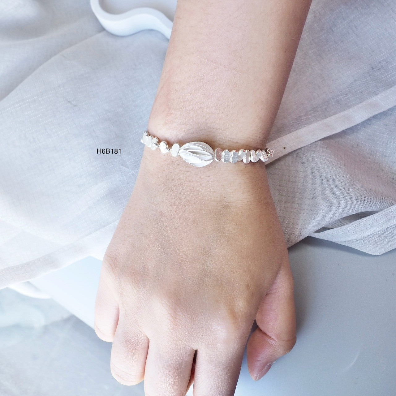 Support authentic Thai artisans with this handmade silver bracelet.